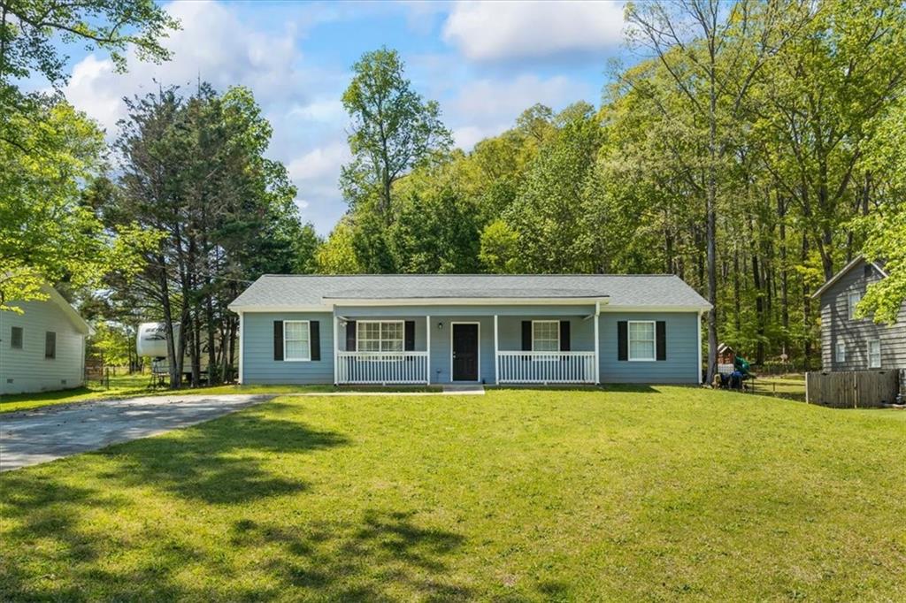 Welcome home to the peaceful Riverbend neighborhood of Covington, GA. This well-maintained home offers a spacious layout with 4 bedrooms and 2 full baths. The roof is like new - only 3 years old! The private backyard provides a serene retreat, perfect for outdoor gatherings or relaxation. Conveniently located near local amenities, parks, and schools, this home offers both tranquility, accessibility and more.