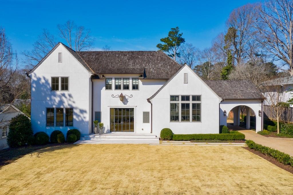 Exquisite custom build in Atlanta's most sought after neighborhood. Designed by Architect, Amanda Orr, this home leaves nothing left to be desired. Beautiful details throughout- iron doors on axis with entry and patio, re-claimed beams, soaring ceilings, and detailed trim throughout. Gourmet kitchen with 18ft ceilings, built in banquet, refrigerated drawers, dual dishwashers, and walk-in pantry. Owner's suite is on main level with 4 bedrooms up & a bonus room with built in work stations. Sellers have recently made several improvements to enhance the original home. Finished basement with Recreation/media room, gym, bedroom, bath and newly finished space for multi-purpose. The back yard feels like you are at a resort- professionally landscaped by Bellwether Landscape Architects with maintenance free turf lawn, heated pool with gorgeous glass surround and covered patio with fireplace. Carriage house has an a full bath and room for bed, living, and office. This is in addition to the bedroom count in listing. Control 4 system provides music throughout various rooms in home, security cameras, and climate control. Custom draperies and light fixtures will remain along with TV's- this home is turn key for the most discerned Buyer.