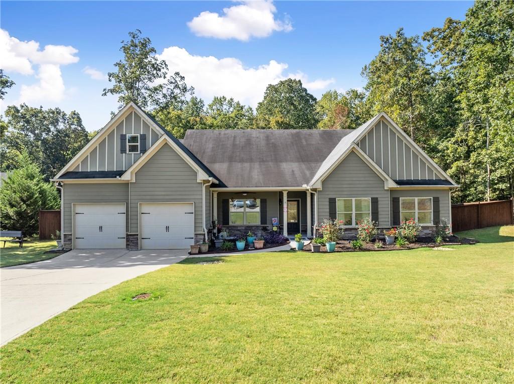 Welcome home to this beautifully maintained 5-bedroom, 3.5-bath ranch perfectly situated on a peaceful cul-de-sac. From the moment you arrive, you’ll be impressed by the gorgeous landscaping and inviting curb appeal. Step inside to find an open and airy floor plan highlighted by gleaming hardwood floors, granite countertops, and white cabinetry that creates a timeless and elegant kitchen space. The layout flows seamlessly into the dining and living areas, perfect for both entertaining and everyday living. The luxurious primary suite is a true retreat, featuring a large soaking tub, double vanities, and plenty of space to relax and unwind. With five bedrooms in total, this home offers plenty of flexibility for family, guests, or a home office. Enjoy the privacy and charm of the landscaped lot, providing plenty of outdoor space for gatherings or simply enjoying the peaceful surroundings. Located close to shopping, dining, and schools, this home is the perfect blend of comfort, style, and convenience. Don’t miss your chance to own this stunning ranch and make this house your home!