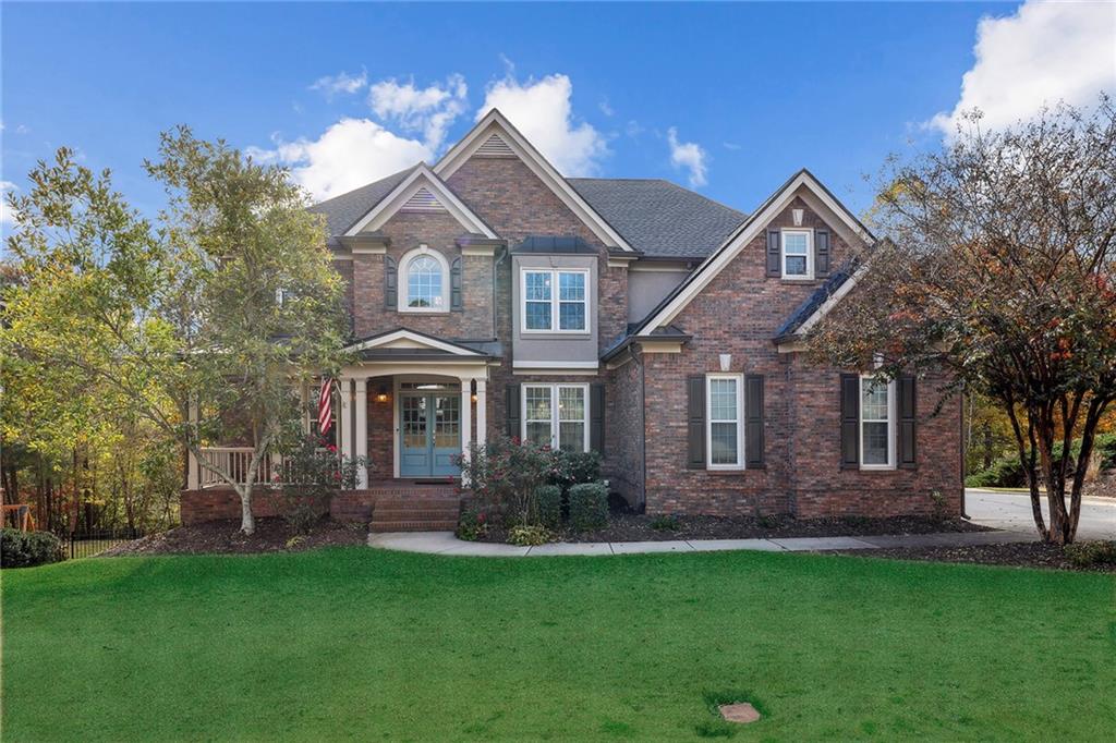 Welcome to this exquisite family retreat in the prestigious Woodleaf enclave of Hamilton Mill, where luxury meets functionality in the award-winning Mill Creek High School District. This meticulously upgraded home is a haven of comfort with its energy-efficient windows installed in 2016 and new roof installed in 2022, alongside new HVAC units equipped with air purifying systems for year-round comfort.
As you step inside, the warmth of the hardwood floors—newly installed and refinished in 2020—invites you into a space where every detail is designed for living well. The gourmet kitchen, remodeled in the fall of 2020, is a chef’s dream featuring a GE Monogram suite of appliances, upgraded marble quartz countertops, shaker-style white cabinetry adorned with hand-crafted pearlescent backsplash tiles, and a spacious walk-in pantry.
Entertainment is a breeze in the expansive game room, or the ideal media room located in the fully finished terrace level. A full wet bar, complete with bottle storage and ample storage, ensures that every gathering is well-catered.
The owner's suite is a sanctuary of luxury with an expansive custom closet, a sitting area for quiet moments, and an en-suite bathroom boasting a dual showerhead system, expansive vanity space, and a beautifully placed soaking tub.
Step outside to the terraced patio installed in 2018 and dive into the 8' deep gunite heated saltwater pool or you may choose to unwind in the hot tub that will remain with the home. The seasonal privacy with the tree lined backyard allow for you to enjoy your pool during the summer and overlook the golf course in the winter months. With exterior paint refreshed in 2020, the home's curb appeal is as inviting as its interior. The three-car garage offers ample storage, complementing the dream laundry/mudroom area right off both garages,
Beyond the walls of this stunning home, Hamilton Mill presents a lifestyle like no other with a 72-par golf course in your backyard, no wait or initiation fee at Hamilton Mill Golf Club, and seasonal privacy to fully enjoy your pool. The community is rich with amenities, including walking trails, pickleball, tennis, volleyball, playgrounds, a splash pad and fountains along with a fully stocked fishing lake. Not to mention, recent enhancements such as new slides coming in 2024 at the pool add to the community charm.
This home, a masterpiece of thoughtful upgrades and comfort, is ready to convey with a stainless-steel refrigerator, gas logs in the fireplace, and even the hot tub, ensuring a seamless transition into your new life of luxury. With every detail carefully curated—from the painted wainscotting and upgraded light fixtures to the built-in bookshelves and desks—this home is more than a residence; it’s a lifestyle waiting to be embraced.
Don't miss out on this unparalleled opportunity in Hamilton Mill.