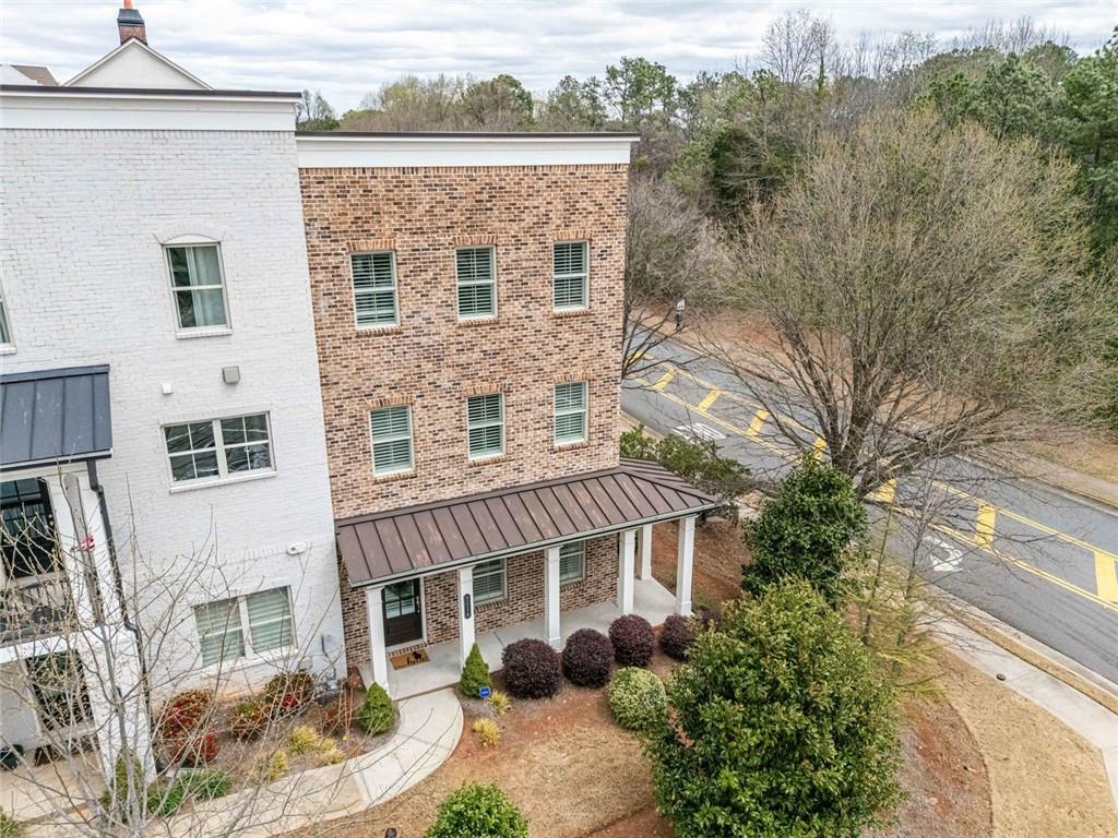 All about lifestyle! Walk from your front door to Amerisbank Amphitheater or North
point Mall. North Point Mall is scheduled for an exciting new re imagining. Beat the rush and get in before the evolution. This is a wonderful end unit designed with an open floor plan.
on the main level enjoy your family room open to the kitchen and dining area. The kitchen features quartz counter tops, double ovens, and stainless appliances. The covered deck is right of this main level and is huge. Great for relaxing or entertaining. Upstairs has 3 bedroom including your en suite master with a large walk-in shower. The first level has a great guest suite with full bath or flex space. Just minutes to Downtown Alpharetta, Avalon, award winning Milton High School and just a 3 Wood away from Top Golf.