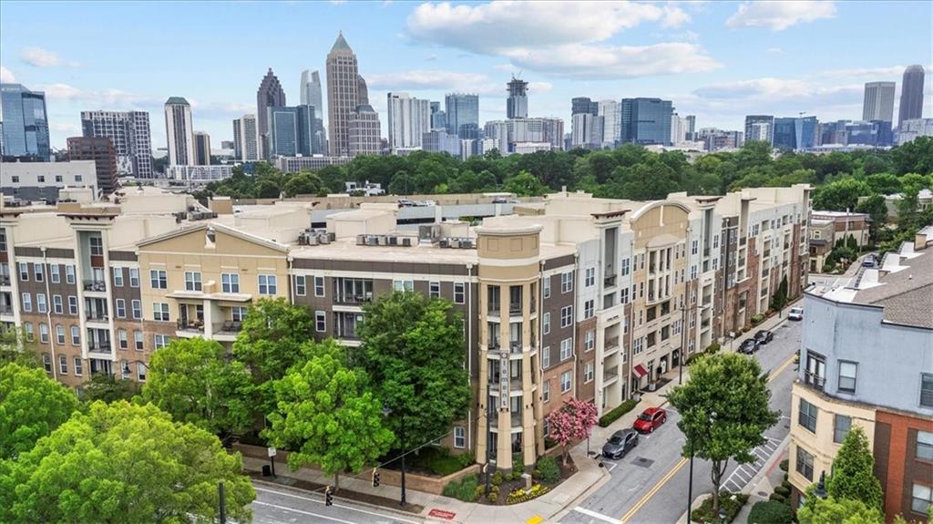 Welcome to The Element! This is where modern comfort meets the vibrant lifestyle of Atlantic Station. Located on the 4th floor, this well-maintained 1-bedroom, 1-bath condo offers beautiful lake views, a clear view of the Millennium Gate Museum, and striking views of the Atlanta skyline. The bright, open layout features a modern kitchen with granite countertops, stainless steel appliances, custom cabinetry, and a breakfast bar that flows into the main living area. Step out onto your private balcony from either the living room or the spacious bedroom, perfect for enjoying your morning coffee or a peaceful evening sunset.
The large primary bedroom offers direct balcony access and plenty of natural light. The bathroom features granite countertops, ample storage, and a generously sized walk-in closet. The washer and dryer are included. For added convenience, both the assigned parking space and dedicated storage unit are located on the same floor as the condo - making access seamless and stress-free.
The Element offers resort-style amenities including a pool, fitness center, dog park, clubhouse, onsite property management, and security cameras on every level for added peace of mind. The HOA fee covers trash and water, and guest parking is free with a guest pass. Enjoy true city convenience. You can walk to Publix, Target, IKEA, and all of the dining, shopping, and entertainment options Atlantic Station has to offer. With close proximity to Georgia Tech, SCAD, Microsoft, and major highways, plus easy access to the Georgia Tech trolley and MARTA. This home delivers the best of intown Atlanta living. Schedule your showing today!