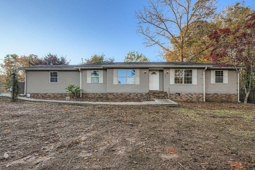 Welcome home to 6431 Courtney Dr.  This 3 bedroom/2 bath well maintained home is situated in a quiet established neighborhood off of Bright Star Rd.  The location is close to everything Douglasville has to offer.  When you step in the front door you are in an open concept living/dining/kitchen area.  Beautiful cabinetry highlights the spacious kitchen with a breakfast bar.  There is room for dining room furniture plus your big screen TV.  The 3 bedrooms are spacious with a beautifully renovated bathroom in the primary bedroom.  The third bedroom has a wall of shelves so it can be used as a bedroom or an office with space for all of your awards.  The secondary bathroom also has been renovated and expanded with beautiful tile work in the tub/shower combo.  There is bright and airy sunroom off of the kitchen with air conditioning for those hot summer days.  In the private back yard there is outbuilding that can be used as a workshop, a kitchen or space for a small business.  There is also a separate walk in cooler, it just needs the refrigeration system checked.  It is a spacious walk in storage room at the moment.  There is also a parking pad that will accommodate at least  a 42foot motor home.  There is power and a sewerage hookup for your RV or Food Truck.  The backyard is private with a wooden fence with a drive thru gate for the parking pad.  You could also grow some vegetables in the backyard! THE POSSIBILITIES AT THIS HOME ARE ENDLESS.  If entertaining is your thing, a food service business or small business this is the place for you.  Come see this cozy gem!!!!!