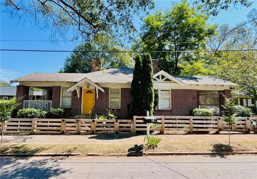 Don’t miss this Rare Opportunity to own this well maintained duplex in the heart of Kirkwood! Each brick one-bedroom, one-bath unit showcases classic charm with hardwood floors, a decorative fireplace, an updated kitchen, updated paint colors, a separate dining area or flex space, a washer/dryer area, and a private covered porch. This versatile property is perfect for living on one side while renting or Airbnb-ing the other. Utilities are separately metered, except for water. Situated just a few blocks from downtown Kirkwood’s vibrant shops and restaurants. Double the charm, double the opportunity—live, rent, or invest in this ideal duplex! (officially 38 & 40 Bates Ave. SE)