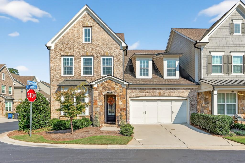 Nestled inside the gated 55+ community of Edenton, this 3-bedroom, 3.5-bath townhome offers a graceful blend of charm and comfort. From the moment you step inside, you are welcomed by a bright front room with custom built-ins, an inviting space that can serve as a home office, library, or simply a quiet spot to unwind. The heart of the home is the family room, where wood beams highlight the soaring ceiling and a striking stone fireplace brings warmth and character. A built-in sound system fills the space with your favorite music, perfect for both everyday living and entertaining.
Hardwood floors connect each space, leading into the kitchen where stone countertops, stainless steel appliances, and a large island make cooking and gathering effortless. The cheerful eat-in area is filled with light, perfect for everyday meals or entertaining, while a dreamy walk-in pantry provides both style and storage.
Conveniently located on the main level, the primary suite is a retreat of its own. The spa-like bath offers dual vanities, a soaking tub, and a walk-in shower, while the built-in closet organization keeps everything neatly in place. On the second level find two bedrooms, one large enough to accommodate a king-sized bed. Just beyond the bedrooms, a generous media room—complete with surround sound, built-in cabinetry, and bookshelves—offers flexible space for movie nights, reading, studying, or simply relaxing.
A covered patio extends your living space outdoors, ideal for morning coffee or evenings with friends, sky watching, or patio gardening. Beyond your doorstep, Edenton welcomes you with a pocket park, cozy outdoor fireplace, and intimate seating nooks, all tucked within the privacy of a gated community.
Bright, airy, and move-in ready, this townhome is filled with thoughtful details that make everyday living feel both easy and special.