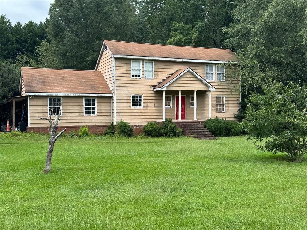 Investor special! Spacious 2-story home on a large corner lot in McDonough with tons of potential. This property features multiple living areas, a separate dining room, and a converted garage for added square footage. Needs full renovation including flooring, paint, siding, windows, kitchen, and baths—perfect project for a fix & flip or rental portfolio. Large backyard with patio, deck, and mature trees offers excellent outdoor space. Conveniently located near schools, shopping, and major highways. Bring your vision and turn this property into a profitable investment!