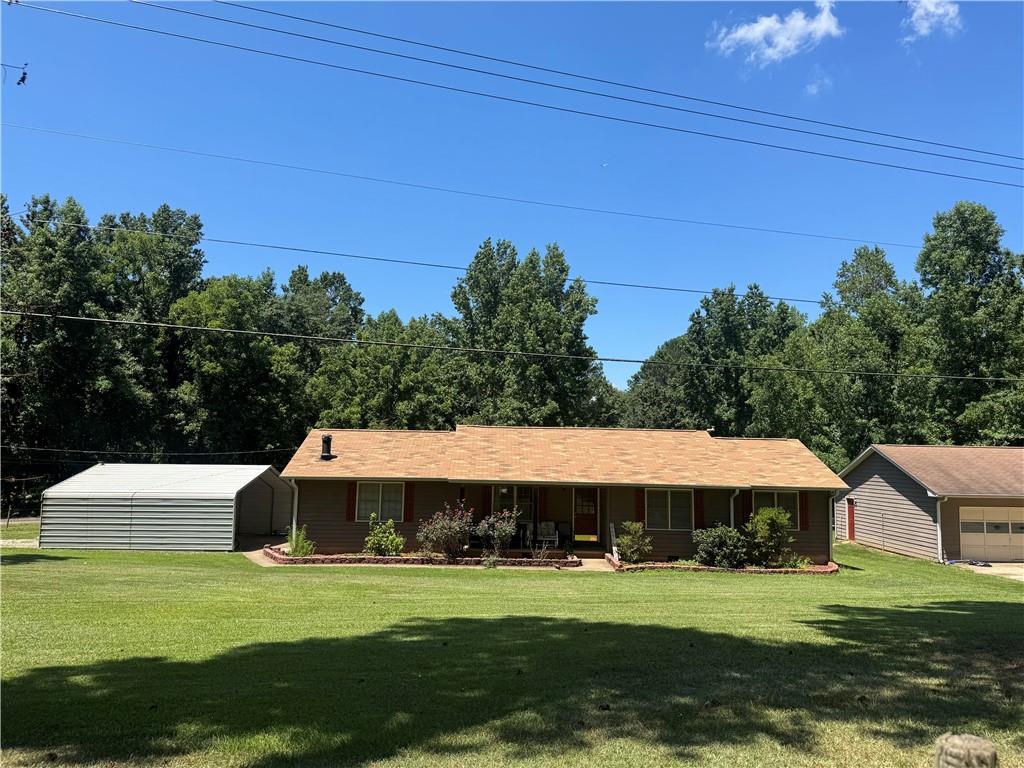 This fenced corner lot boasts 2.8 acres of land!!!! 2 parcels included in this sale. This is a well maintained owner property ready for a quick move in. This home has 3 bedrooms, 2 baths and it includes a detached garage workshop area perfect for anyone who appreciates woodworking. The workshop is equipped with 220V, equipment shed and metal carport. New roof and new carpet/flooring throughout. This home is perfect for entertaining outdoor gatherings. This property is a short distance to 1-285, I-85, Atlanta's Hartsfield-Jackson Airport, shopping, and restaurants. This property is also near great outdoor green spaces, like the beautiful Cochran Mill Park.