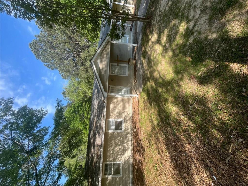 Quietly nestled in a serene neighborhood, this beautifully renovated 6-bedroom, 3-bathroom home offers comfort and convenience. Enjoy a modern kitchen with sleek black appliances, internet included, and a spacious double deck and large yard space perfect for entertaining. Located near restaurants, public transportation, and more-this is stylish living in the heart of South Fulton! Housing Vouchers Accepted.