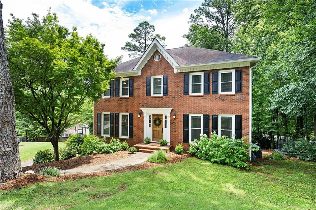 Located in the top-rated Lassiter High School district, this thoughtfully updated 4-bedroom, 2.5 bath home combines warm, modern finishes with versatile living spaces—both inside and out. Step inside to find brand-new French oak wood floors throughout and recessed lighting that brings a bright, elevated feel to every room. The spacious living area features a charming whitewashed brick fireplace, adding a cozy focal point to the main floor.
The newly renovated kitchen is a standout, featuring white and grey Calacatta Laza quartz countertops, subway tile backsplash, updated appliances, custom ceiling-height open seeded glass cabinet, soft-close drawers, and a dedicated bar area - perfect for entertaining. From the kitchen, you'll see stunning views of Sweat Mountain with along with a lush landscaped backyard. Walk directly outside to an expansive deck with a shaded pergola offering the perfect setting for year-round gathering and quiet mornings alike.
Upstairs, the primary suite includes an oversized walk-in closet with custom built-ins, and the secondary bedrooms offer great space and natural light. The finished basement provides additional flexible living space for a media room, playroom, gym, or home office. The beautifully landscaped backyard features a large, level lawn ideal for sports, gardening, or future plans—and plenty of space to make it your own.
Located in the established East Cobb neighborhood of Stocktons Place—this home blends everyday ease with custom-quality upgrades you’ll feel in every room.