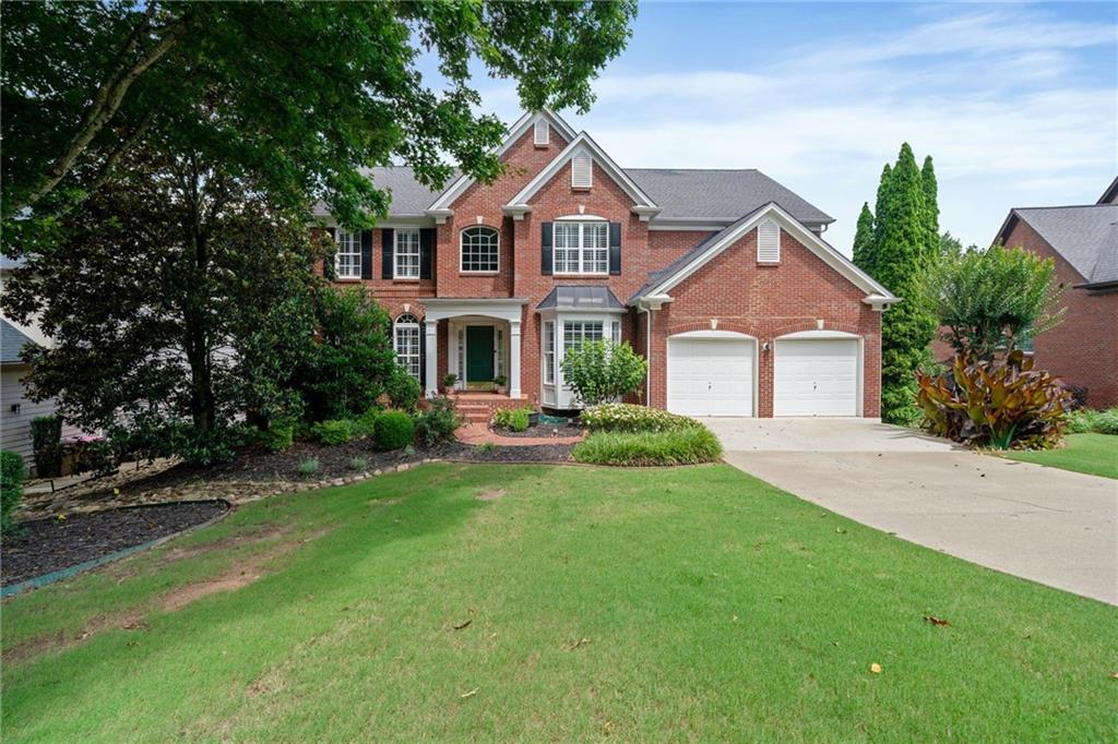 Beautiful home in a sought-after community with top-rated schools and incredible amenities including a lake, pool, tennis and pickleball courts, playground, and active swim and tennis teams. This light-filled home features hardwood floors throughout, a spacious dining room, flex room, guest bedroom with full bath, and a renovated chef?s kitchen with large island, updated appliances, and stove vented to the outside. The kitchen opens to a stunning two-story family room?ideal for entertaining. Upstairs, the primary suite offers peaceful lake views and a spa-like bath, along with three additional bedrooms and two full baths. The full, partially finished basement includes a TV room, bedroom, and full kitchen perfect for guests or multi-generational living. Enjoy lake views from the deck or patio, with private stair access to the water for fishing or launching a kayak. Garage includes an electric car charger. This home offers the perfect mix of space, style, and community lifestyle.