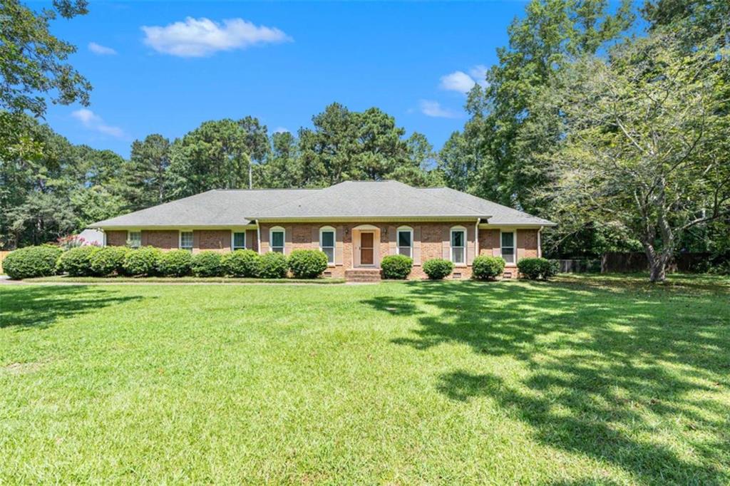 Welcome to this beautifully maintained ranch-style home. This property is located on a spacious lot in an established neighborhood. The home offers a separate living and dining room area, creating a warm and inviting atmosphere. Enjoy the convenience of single-level living, with a functional layout that flows from room to room. Step out onto the scenic sunroom, perfect for morning coffee, relaxing evenings, and entertaining guests. The sunroom overlooks a grand backyard--ideal for outdoor gatherings, gardening, a kids' play area, or simply enjoying the peaceful surroundings. The fenced backyard provides additional privacy and security. Just minutes away from shopping at the Fayette Pavilion and restaurants. Combining classic charm with modern comfort, this is the perfect place to call home.