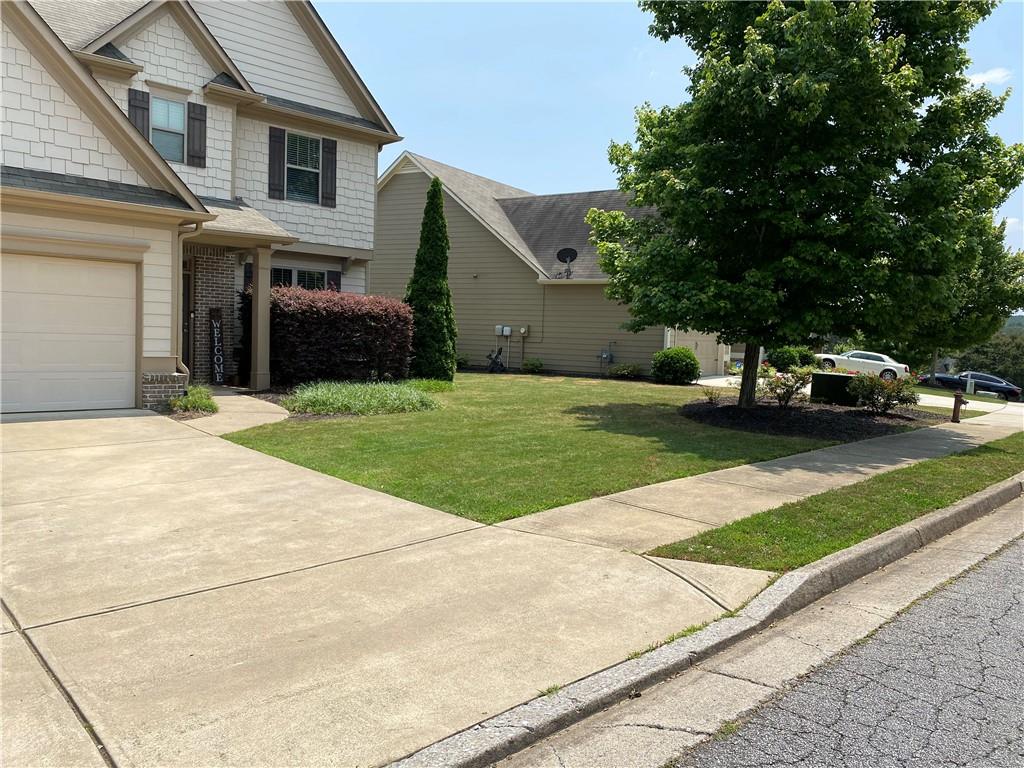 Welcome to one of the most sought after subdivisions in Georgia, the Seven Hills community. This beautiful home comes with some astonishing upgrades, high ceilings, stained cabinets, new LVP flooring and a backyard oasis featuring a pool with gunite, diving rocks, saltwater and decorative pavers. The open floor plan has lovely hardwoods, marble fireplace with gas logs in the living room that is inviting for gatherings. In the kitchen area you will find country cabinets, granite countertops with a flowing backsplash and an island. The renovated over-sized owner suite leads directly into the en-suite bathroom with a tile shower, double vanities, frameless glass shower doors, garden tub and a walk-in closet. The landscaping has been refreshed and has charming curb appeal. Routine lawn and pool maintenance included. This home will not let you down, call and schedule a tour! No pets allowed.
