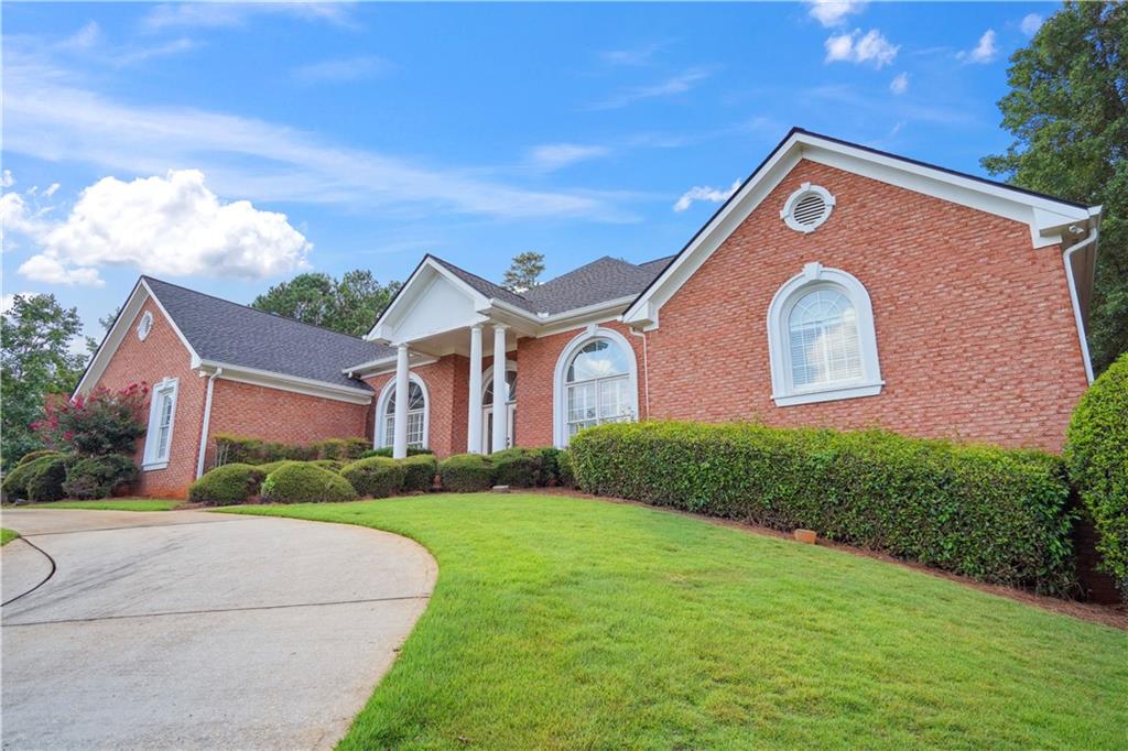 Stunning All-Brick Home in Prestigious St. Remy Subdivision – 4 Beds | 4.5 Baths |Partially Finished Basement | Gunite Saltwater Pool
Welcome to this exquisite 4-bedroom, 4.5-bathroom all-brick home located in the highly sought-after St. Remy subdivision. This elegant residence showcases exceptional finishes and thoughtful design throughout, including crown molding, rich tile and wood flooring, and a spacious full basement. Step through the leaded glass French doors into a grand entrance and beautiful receiving area that sets the tone for the rest of the home. Just off the foyer, you'll find a versatile office or sitting room complete with its own full bath—perfect for guests or working from home. The formal living room is both spacious and inviting, featuring a stone-tiled hearth fireplace with gas logs and serene views of the stunning pool area. The heart of the home—the kitchen—offers an oversized island, walk-in pantry, plentiful cabinet and counter space, and a conveniently located half bath. The massive owner's suite is a true retreat, complete with tray ceiling, a peaceful sitting area overlooking the pool, and direct access to the wraparound deck. Enjoy dual walk-in closets, a luxurious spa-style en suite with double vanities, a tile and glass shower with dual shower heads, and a deep soaking tub. Secondary bedrooms are generously sized with large closets and share a well-appointed Jack-and-Jill bathroom. The large laundry room includes a sink, cabinetry, and folding counters for convenience. Downstairs, the partially finished basement boasts laminate wood flooring, four finished rooms ideal for recreation, hobbies, or guests, and a custom wet bar—perfect for entertaining. Four sets of doors lead directly to the show-stopping backyard. Outdoors, you'll find a private oasis: a Gunite saltwater pool with a hot tub and cascading waterfall, surrounded by stately brick walls and an iron gate for privacy. The expansive covered back deck wraps around the home and provides a protected area for outdoor dining, grilling, or relaxing—even in inclement weather. Additional features include a whole-house central vacuum system and a Rain Bird irrigation system, making maintenance easy and efficient. 3-car garage with multiple parking spaces on primary driveway and circular driveway.
This one-of-a-kind home offers space, luxury, and timeless appeal—don’t miss the opportunity to make it yours!