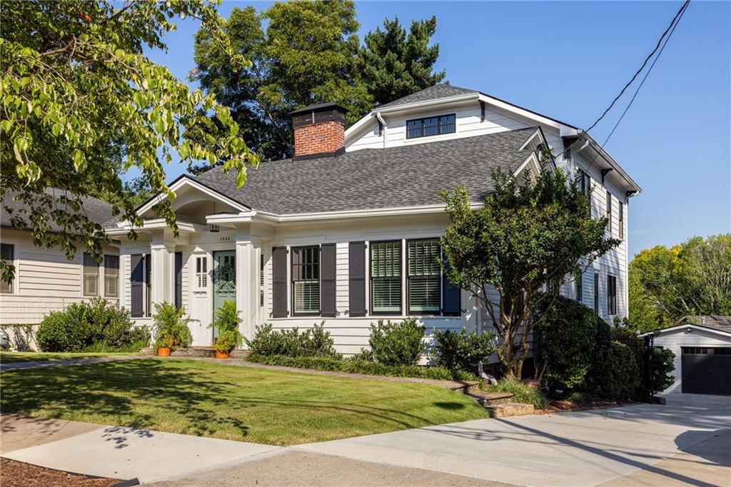 One of Intown Atlanta's most sought after locations, live in the heart of EVERYTHING. This 1918 Craftsman Bungalow blends timeless historic details with complete modern amenities. Don't miss this stunning renovation that was just completed by the homeowners less than a year ago. Enter the home through a sunlit living room with the perfect office just off to the side, two oversized bedrooms on main with private baths tucked next to the gorgeous kitchen, marble countertops and modern day butler's pantry accompanying the dining area. The dinning area opens onto the screen porch, perfect for entertaining or hosting those family holiday dinners. Upstairs you will find a generous primary bedroom with large walk in closet and stunning bathroom, down the hall an additional oversized bedroom with a fourth private bathroom. You will find loads originals details, heart of pine hardwoods, historic doors and fireplaces, along with ALL the modern convivences of today's living. No stone unturned with encapsulated crawlspace, renovated one car garage, electric charger for your vehicle and remote driveway gate. WALK to literally all the BEST of intown living, Freedom park farmers market, Madeira Park, East Pole Coffee, Collette Bakery, the Carter Center. This home is just steps away from the path for getting into multiple neighborhoods in just minutes. This impeccable home hits on ALL the notes, classically renovated, best location, great schools, don't miss out, it will go fast.