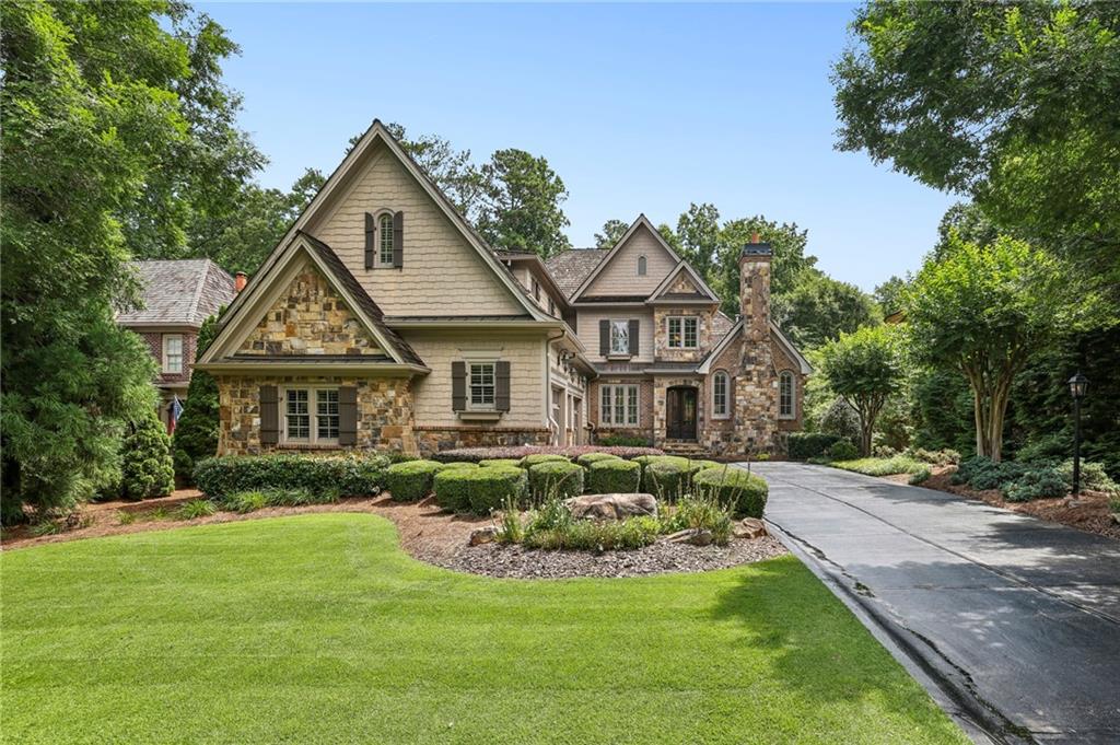 Discover refined living in this gorgeous estate home nestled within the exclusive Ardsley enclave of Windward—one of Alpharetta's most sought-after gated communities. Designed for comfort, entertaining, and everyday luxury, this home offers an ideal blend of indoor elegance and inviting outdoor living.
The main level features a spacious primary suite with a fireside sitting area, spa-inspired bath, and custom walk-in closet, plus private access to the beautifully landscaped backyard. Step outside to your own serene retreat, complete with a cocktail pool and waterfall, dedicated grilling station, cozy covered patio with a wood-burning fireplace, and a built-in fire pit—perfect for year-round enjoyment.
Inside, hardwood floors run throughout the main level, which also includes a formal living room, open-concept dining room, and a versatile home office or flex space. The gourmet kitchen is a chef’s dream, featuring a wet bar, expansive island, walk-in pantry, and a sunny keeping room with plenty of space to gather. A functional mudroom off the three-car garage includes a built-in desk, laundry room, and custom finished walk in pantry.
Upstairs, you’ll find a large media or flex room and three generously sized bedrooms, each with its own en suite bath, offering privacy and comfort for family or guests. The full, unfinished basement presents endless opportunities to customize the space to your lifestyle.
Enjoy Windward’s resort-style amenities including proximity to the Golf Club of Georgia, Windward Lake Club, top-rated schools, and quick access to GA-400, Avalon, and all that Alpharetta has to offer.