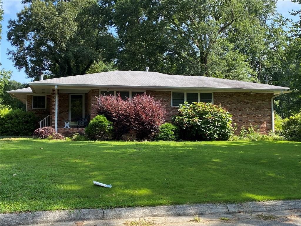 Investor Special – Brick Ranch on Level Lot (Sold As-Is) - Great opportunity for builders or renovators! This 3-bedroom, 2-bath brick ranch sits on a beautiful level lot with a private, fenced-in backyard and a storage shed. Spacious layout includes a fireside family room, formal dining room, large finished rec room, and kitchen with tile floors, built-in shelves, gas stove, range hood, dishwasher, and refrigerator. Features include: hardwood and tile flooring, newer windows, ceiling fans, covered patio perfect for entertaining, and a gorgeous backyard with plenty of green space. Convenient location with strong potential. Home is being sold as-is. Bring your vision and make it your own.