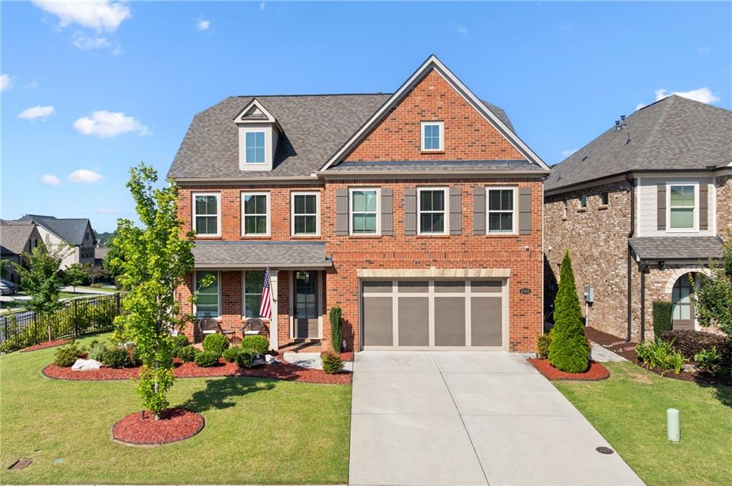 Welcome to this beautifully maintained 3-sided brick home, perfectly situated on a professionally landscaped corner lot in a highly sought-after neighborhood. With 5 bedrooms and 3.5 bathrooms, this home offers space, style, and thoughtful upgrades throughout. Enjoy the flexibility of two luxurious primary suites - one on the main level and another upstairs. The main-level suite features a large walk-in shower and double vanities, while the upstairs suite includes a soaking tub, separate glass shower, and double vanities-perfect for guests or multigenerational living. The heart of the home is the custom-designed kitchen featuring a huge island, breakfast bar, painted cabinetry, walk-in pantry, drawer microwave, farmhouse sink, Insta-Hot purified water system, and a massive gas range-a dream for home chefs. The kitchen opens to a spacious living room with a beautiful fireplace and flows into a bright sunroom that can be closed off for privacy-ideal for a playroom, home office, or additional lounge space. The formal dining room with coffered ceiling provides a sophisticated space for entertaining. Throughout the home, you'll find custom closets, wired sound system, and spacious secondary bedrooms and bathrooms. Step outside to a fully equipped outdoor kitchen with a built-in gas grill, a pergola, and a serene garden space. The full sprinkler system makes maintaining the lush yard effortless, while the corner lot provides added privacy and curb appeal. Additional highlights include a 2-car garage, upgraded lighting, and refined finishes throughout. This home combines comfort, elegance, and function - perfect for everyday living and exceptional entertaining. Schedule your private showing today!
