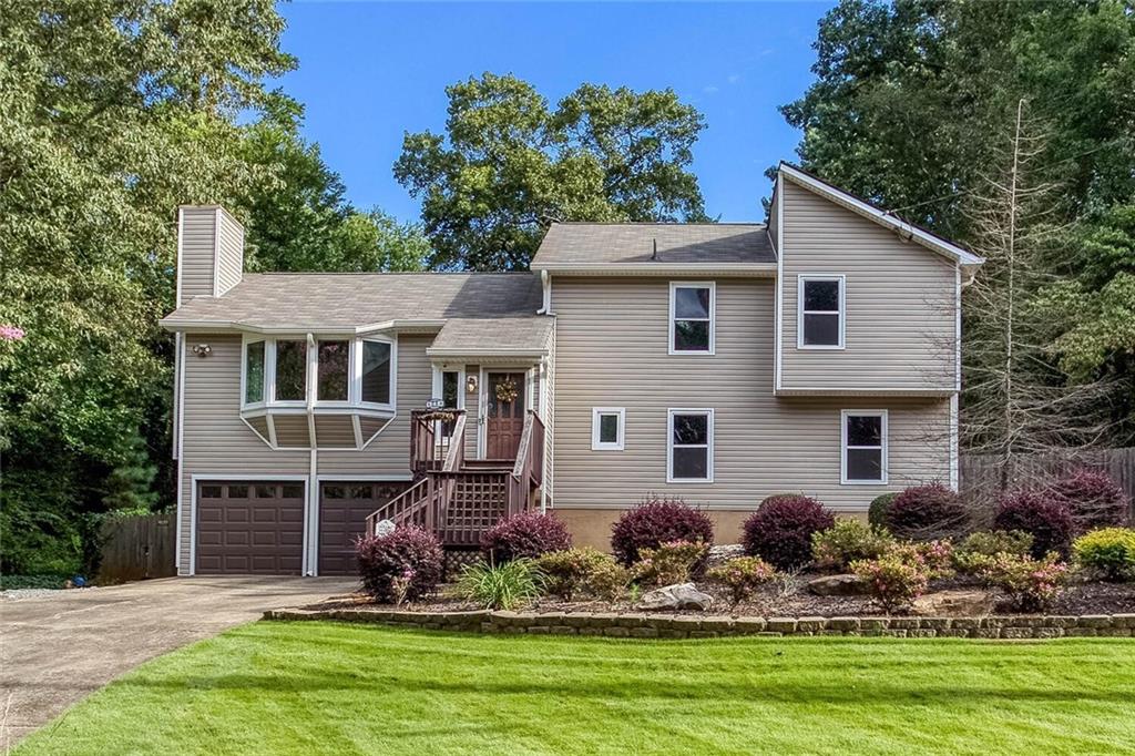 New Roof, New HVAC, New Water Heater, New Windows, new floors upstairs. In 2021 home had new siding and new insulation wrap installed. All of the major stuff has been done. All it needs is a little paint. The kitchen is ready for your culinary adventures with all appliances in place. The home's split-level layout offers versatile living areas, including an unfinished space in the basement that can be customized to suit your needs, whether it's for a recreation room, office, or extra storage.This home offers comfortable and functional living in a highly desirable area. The spacious landscaped lot has a fenced backyard and irrigation in the entire yard. Located in the Cobb school district. Seller offering a $2000 credit for paint.