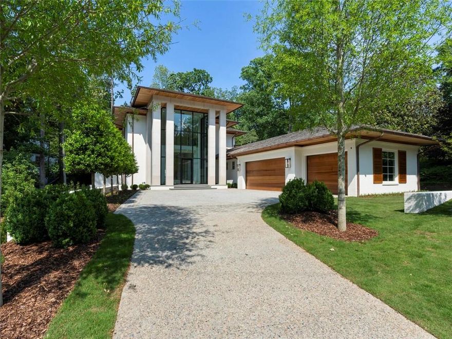 EXCELLENT PRICE IMPROVEMENT IN HISTORIC BROOKHAVEN!!! A triumph of architecture and craftsmanship, this luxurious masterpiece modern home is the creation of MJunger Homes in one of Buckhead’s premier neighborhoods. A private retreat with landscape design by Graham Pittman, it is beautifully sited on a quiet street adjacent to Vermont Park and a short walk to the Capital City Club in coveted historic Brookhaven. In award-winning Sarah Smith Elementary School District and convenient to Atlanta's major travel thoroughfares, the home is located just minutes to Buckhead's finest dining, shopping and entertainment with Phipps Plaza right around the corner. Turnkey ready, you can be the first to enjoy three superb levels with incredible design details, white oak flooring, arched cypress ceilings, custom cabinetry and millwork throughout. Elevator core to all 3 levels. Steel framed insulated glass walls with pivoting doors open from the Fireside Great Room to the private backyard oasis including a gorgeous heated Pool, Spa, Water Feature, Cabana, Outdoor Fireplace, Gourmet Grilling Kitchen and half bath/changing room. There are bedroom suites on every level and the Upper Level Primary Bedroom Wing boasts a stunning Marble Bath with soaking tub, frameless-glass double shower and two water closets. There’s an upper level Bonus/Recreation Room, the most beautiful Laundry Room you’ve ever seen and main and secondary staircases to the upper and lower levels. The terrace level provides Recreation Spaces, a fabulous Wine Room, Exercise Room, Bedroom Suite as well as 1,700sf of unfinished space for anything else your heart desires! From the dramatic front façade of two-story limestone columns and glass to the central core of floating staircases, to the amazing backyard providing resort-style entertainment spaces, the home is a unique design centric collaboration which will last for generations to come. TAKE A LOOK AT THE VIRTUAL TOUR!