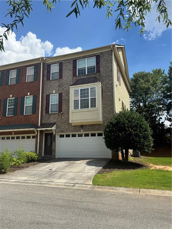 End unit 3 level townhome with modern open concept floor plan. Excellent condition, high ceilings, large kitchen with granite tops and kitchen island, spacious master bedroom and bathroom. All three bedrooms with their own full bath, laundry on bedroom level, 2 car garage, minutes to I-75, near KSU, Marietta Square, Truist Park.