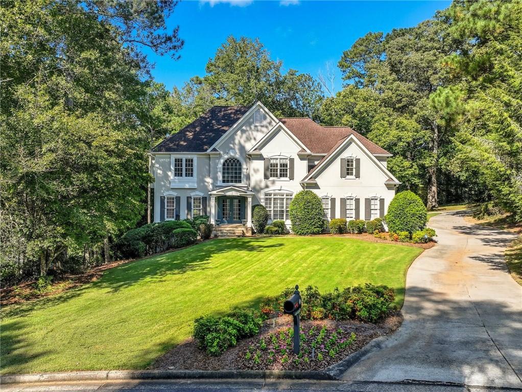 Welcome to this stunning luxury residence in the sought-after Providence Lake community of Alpharetta. Situated on over an acre, this hard-coat stucco home offers more than 5,400 square feet of thoughtfully designed living space within the highly regarded Fulton County school system, including the prestigious Mill Springs Academy just moments away.
From the moment you step inside, you’ll appreciate the open flow between the kitchen, eat-in breakfast area, and living room, perfect for both everyday living and entertaining. A private study on the main level features custom built-in bookshelves and serene morning views, while the screened-in porch and expansive deck with a retractable awning invite you to enjoy the outdoors year-round.
The lower level is a true extension of the home, offering a full bedroom and bathroom, a large living area, and a future in-law suite potential with a 220-amp washer/dryer hookup. A boat garage door on the backside of the home makes loading projects or lake gear effortless, while the full workshop ensures plenty of space for hobbies. Upstairs, a convenient laundry chute adds a touch of practical luxury.
Outdoors, the property’s crown jewel is its private dock on Providence Lake, with a beautifully redone walkway leading to the water’s edge—perfect for enjoying the views, fishing, or simply unwinding by the lake. Even the irrigation system adds value, drawing from the private lake with a pump, keeping lawn care costs lower than most properties in the county.
Life at Providence Lake offers more than just a home—it’s a community. Residents enjoy access to a swimming pool, tennis courts, clubhouse, and playground, creating a true neighborhood lifestyle with recreation right at your doorstep.
This exceptional home seamlessly combines elegance, function, and community in one of Alpharetta’s most desirable locations.