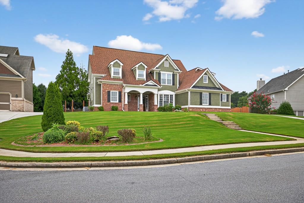 Welcome to Your Dream Home in Loganville!
Tucked inside a picturesque neighborhood with amenities including a community lake, swimming pool, and tennis courts... this beautifully maintained home has everything today’s buyers are looking for with the primary suite on the main level it offers comfort and convenience, with an elegant bath designed for relaxation.
Step inside to soaring high spring ceilings and a dramatic two-story fireplace surrounded by custom built-in bookcases — perfect for cozy evenings or entertaining in style. The kitchen opens to a sunny breakfast area and keeping room, plus a separate formal dining room for special gatherings and keeping room for more entertaining space. Stainless appliances, dry bar, freshly painted kitchen and oversized laundry room with sink.
Outside, you’ll love the fenced backyard oasis, professionally landscaped and full of charm, covered patio with access to family room and primary suite — Upstairs you will find a loft area, 3 additional bedrooms with two full baths and tons of closet and attic space for storage.