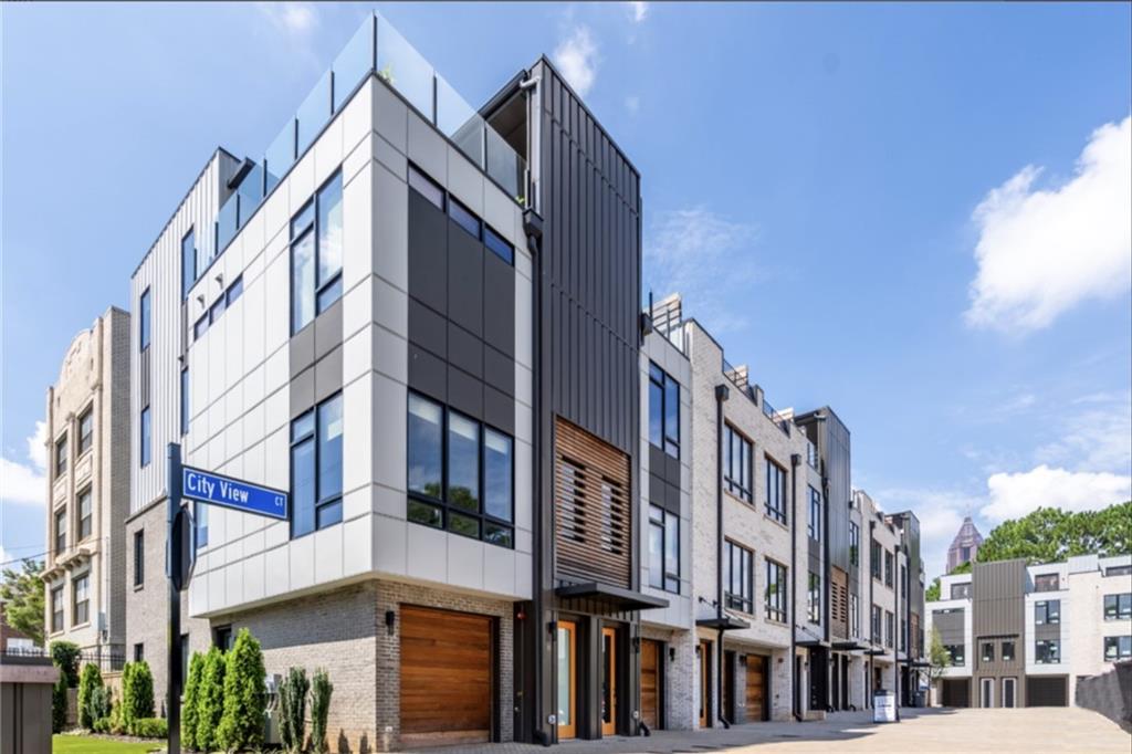 AVAILABLE IMMEDIATELY for lease, lease purchase, or sale! Experience luxurious living in the heart of Old Fourth Ward with this modern LUXURY TOWNHOME. Ideally situated just a 3-block stroll away from Ponce City Market, the beltline, and Piedmont Park, and less than a mile from Interstate/GA Tech/North Ave Marta station, you'll relish the convenience of Inman Park, Krog Street, and Virginia Highland, all within a mere 10-minute reach. This exquisite townhome combines elegance and modern convenience with beautiful hardwood flooring throughout, soaring 10ft ceilings, and multi-zoned AC systems for year-round comfort. Enjoy spacious walk-in closets and seamless connectivity with Google Fiber high-speed internet. The fenced backyard, finished with lush turf, provides a private retreat for relaxation or play. Featuring two generous bedrooms, a large flex room, and 3.5 bathrooms, the home is designed to fit every lifestyle. The versatile 4th-floor space can serve as an office, entertainment lounge, or guest suite, complete with a custom wet bar, fridge, and extra storage. Step onto the rooftop deck to take in stunning views of the downtown skyline. The custom outdoor kitchen—with a sink, fridge, and ice maker—makes this the ultimate spot for entertaining and enjoying Atlanta’s vibrant cityscape. Don’t miss your chance to own this one-of-a-kind home with exceptional amenities in a premier location. Schedule your private showing today!