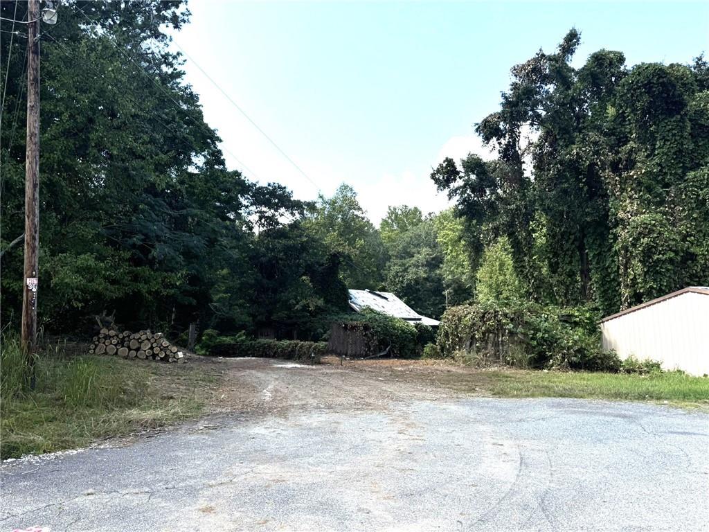 A .76 acre Lot in Downtown Dawsonville. The lot is currently zoned CBD (Central Business District). The perfect location to build a multi family unit. Sewer and public water is available. Property Adjoins the backside of the dollar general on 53 just above the Dawson County Historic Courthouse. Do not enter the property without an appointment. Do not enter the building on the property as it is unsafe.