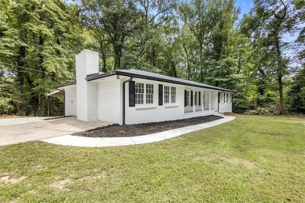 Fully renovated four-sided brick ranch on a 1.37-acre corner lot with a separate workshop! This 4-bed, 2-bath home offers an open floor plan, new kitchen with quartz counters, stainless appliances, and island, plus refinished hardwood floors throughout. Bathrooms feature custom tile, updated vanities, and modern fixtures. Enjoy two brick fireplaces, a screened porch, and an encapsulated crawlspace.
Located just minutes from downtown Douglasville, Arbor Place Mall, local parks, and I-20, you’ll have quick access to shopping, dining, and an easy commute to Atlanta. Rare find—move-in ready with classic charm and all the modern updates.