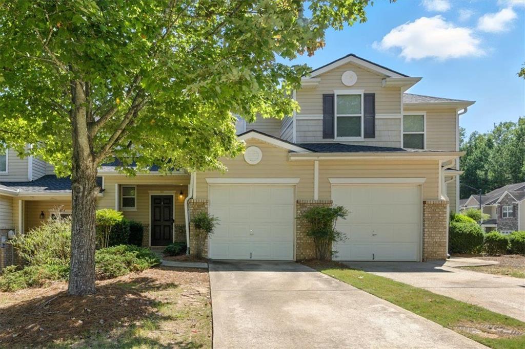 Looking for amazing value? This is it! This home has been recently upgraded with a new roof, new water heater, and 2023 heat pump replacement—meaning you can relax knowing the big-ticket items are already taken care of. Plus, the low HOA fee covers the building exterior (including the roof!), weekly trash service, termite coverage, and lawn maintenance. That’s years of worry-free living with minimal upkeep. Step inside to a light-filled, open-concept main level with a spacious living room, dining area, and a kitchen loaded with cabinets and counterspace—perfect for everyday living and entertaining. A convenient half bath and secure one-car garage with opener complete the first floor. Upstairs, the large primary suite boasts a tiered ceiling, walk-in closet, and jetted soaking tub for the ultimate retreat. A generous secondary bedroom, oversized second bath, and laundry room round out the upper level. The community itself is a gem—offering a pool, basketball courts, a park, and a pavilion for gatherings. Sidewalks throughout make it easy to stroll, with plenty of extra parking for guests. For added peace of mind, Woodstock Police and Fire are located right at the community entrance. All of this in a prime location on Hwy 92 near I-75—just minutes from Downtown Acworth, Downtown Woodstock, KSU, and Red Top Mountain for hiking, camping, and boating adventures. To make a great home even better, take advantage of a 1/0 interest rate buydown at no cost to you OR a $500 lender credit toward closing costs—making homeownership more affordable from day one! This townhome checks every box: value, updates, location, and lifestyle. Don’t miss it!
