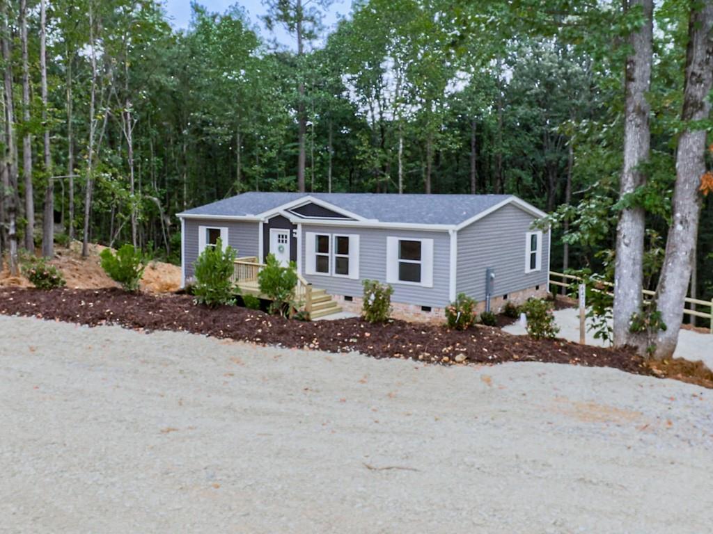 Brand new, move-in ready 2025 manufactured home on 1.5 acres! This 3-bedroom, 2-bath home offers an open-concept design and is permanently affixed to the property with a retired title. Built in 2025 on a full foundation, it qualifies for traditional financing and is taxed as real estate—offering all the comfort and quality of a site-built home with the affordability of a manufactured one. Features include stainless steel appliances, sheetrock walls, crown molding, thermal pane windows, and 2x6 exterior walls for superior energy efficiency. Conveniently located just 3 miles from Hwy 515 in Jasper. No HOA. Don’t miss your chance to see this beautiful property in person!