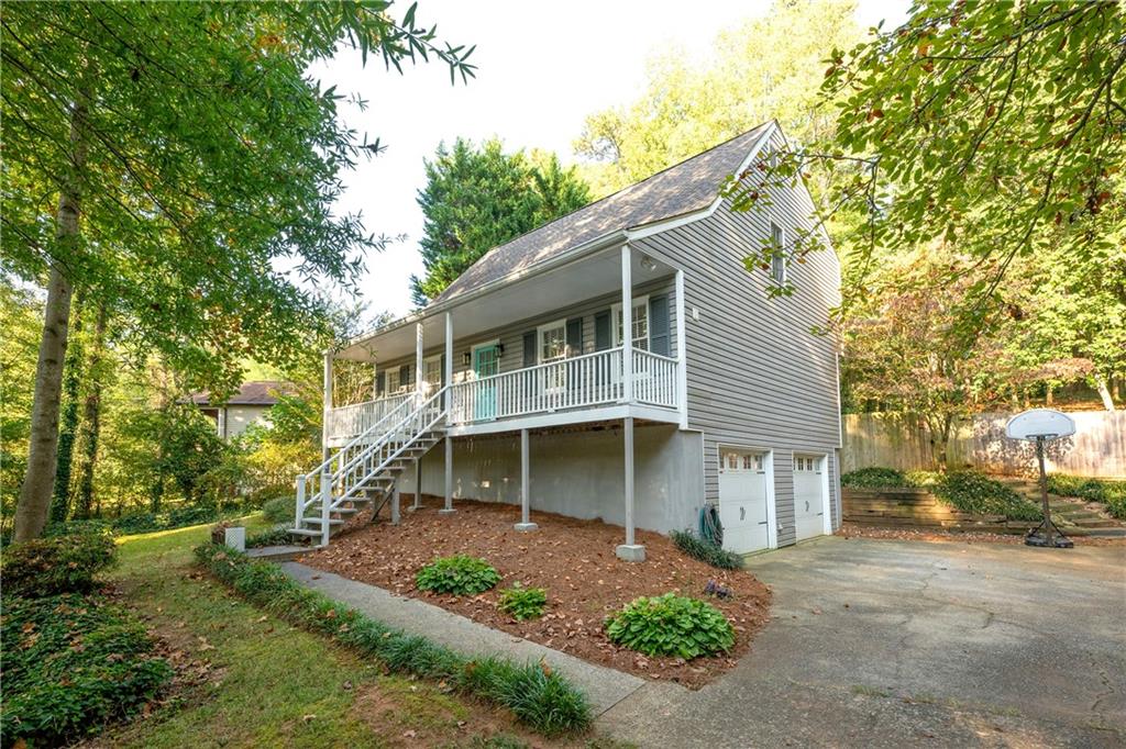 Welcome to this beautifully updated home in the vibrant Woodbine Station subdivision, located within the highly sought-after Garrison Mill, Mabry, and Lassiter school districts.
Recent upgrades include: fresh interior paint, brand-new flooring throughout, a fully remodeled kitchen, updated bathrooms, freshly smoothed ceilings, upgraded copper-to-flex plumbing, a front privacy fence, and designer lighting fixtures in nearly every room.
The main level offers an open floor plan featuring a formal dining room, a flexible office space, a stylish half bath, and a living room with a whitewashed stone fireplace that flows seamlessly into the chef’s kitchen. The kitchen showcases premium quartzite countertops, a new Carrara marble herringbone backsplash, stainless steel appliances, soft-close cabinetry, a custom refrigerator surround with pantry, and an oversized stainless steel sink with modern faucet.
Through French doors off the living area, step into a spacious screened-in porch overlooking a private, shaded backyard. Set on over half an acre, this serene outdoor retreat blends indoor comfort with natural beauty—perfect for morning coffee, evening gatherings, or relaxing in complete privacy.
Upstairs, the primary suite includes a walk-in closet and a beautifully updated bathroom. Two additional bedrooms, including an oversized secondary with its own walk-in closet, share a renovated full bath with new vanity, flooring, mirror, and lighting.
The basement, attached to the two-car garage, offers potential for a home gym, mudroom, or additional flex space. Major systems, including the roof, HVAC, and water heater, have all been updated within the past seven years.
Enjoy the community’s swim and tennis amenities and the convenience of living in a truly active neighborhood. Don’t miss this opportunity to call Woodbine Station home!