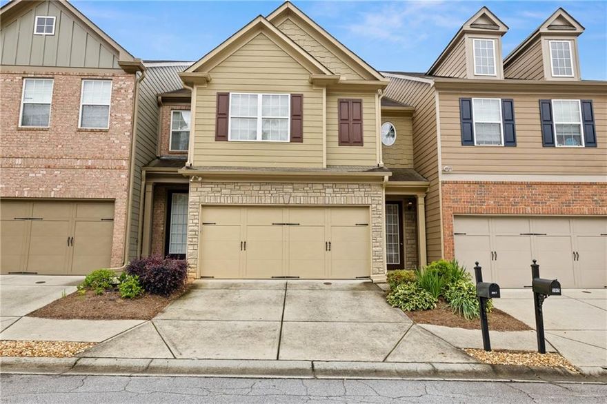 Located in the heart of Hamilton Mill and the highly sought after Seckinger High School district, this charming three bedroom low maintenance townhome is in the center of everything! The main level features a spacious fireside living room that opens to the eat-in kitchen with island with brand new LVP flooring and paint. Upstairs you will find a spacious primarty bedroom. The ensuite bathroom makes mornings easier with its double vanity, soaking tub for winding down, and separate shower. Two additional bedrooms share a second full bathroom, and the nearby upstairs laundry adds extra convenience to your daily routine. The versatile loft area offers endless possibilities, making it the perfect spot for a second living space, a playroom, or a functional home office tailored to your needs.

This home is just minutes away from shopping and dining options and offers easy access to I-85 and the Mall of Georgia. The HOA provides an array of amenities including a gated community, swimming pool, tennis courts, fitness center, clubhouse, playground, and comprehensive maintenance of the grounds, exterior, roof, gutters, water, and trash services.