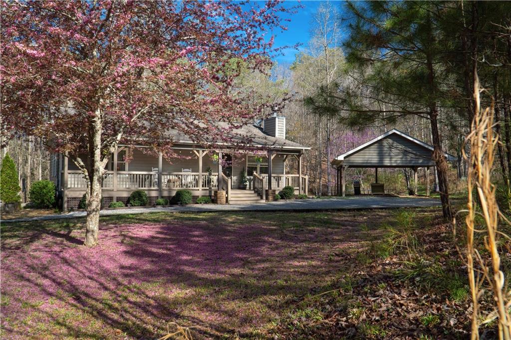 Escape to the majestic North Georgia Mountains with this exceptional 3-bed, 3-bath rustic cabin in the sought-after Coosawattee River Resort. Tucked away on 0.82 acres of wooded serenity, this property perfectly blends modern comfort and mountain charm.
Step inside to an open-concept main level featuring a cozy stone fireplace, a bright living room, and a chef-friendly kitchen with stainless steel appliances and ample cabinetry. Two bedrooms and two full baths on this level make everyday living convenient.
The finished terrace level offers a private retreat with an additional bedroom, full bath, and bonus living space—ideal for guests, a game room, or a home office.
Outside, enjoy the expansive covered deck, sip your morning coffee to birdsong, or gather around the outdoor fire pit for starlit evenings.
Ownership in Coosawattee includes exclusive resort amenities:
River access for tubing, fishing, and kayaking
Multiple swimming pools and parks
Hiking trails and picnic areas
Whether you envision a full-time mountain residence, a weekend getaway, or a high-performing short-term rental, this cabin is a rare find in one of Ellijay’s most desirable communities.
Don’t miss the chance to make this mountain retreat your own private paradise!