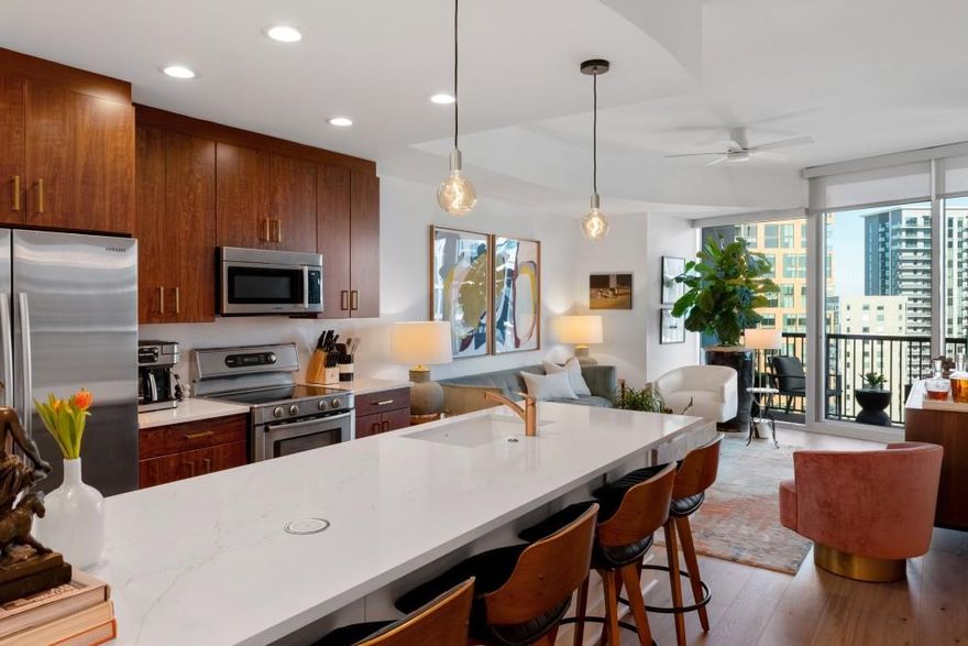 Perched high on the 19th floor of Midtown's iconic 1010 building, this beautifully updated 1 bedroom residence delivers a front row seat to Atlanta's skyline. Floor to ceiling windows and a private balcony capture dramatic views down Peachtree Street - enjoy the evening light show on the Federal Reserve and the Bank of America tower. Inside, more than $25,000 in September/October 2025 upgrades elevate the space: new engineered hardwoods, sleek quartz countertops, modern sinks and fixtures, updated electrical switches/outlets and designer ceiling fans and lighting. The open concept layout is both functional and elegant, with 10 foot ceilings, hardwood flooring and wood cabinetry that are hallmarks of 1010 Midtown homes. A spa-inspired bath features frameless glass and stylish tile, while the bedroom offers generous closet space. The condominium is offered fully furnished, with curated art pieces available for purchase. Residents enjoy resort-style amenities rarely found in the heart of the city: controlled access, a 24 hour concierge, a skyline pool with cabanas and grilling area, a state of the art fitness center, manicured Sky Park, and a club room with catering kitchen and terrace. Secure covered parking, high speed elevators, and ground floor retail/dining add convenience. Located on the Midtown Mile, 1010 Midtown is minutes from Piedmont Park, MARTA, and some of Atlanta's best restaurants, shops and entertainment. This is a rare opportunity to own a fully updated, move-in ready home in one of Midtown's most sought after addresses combine stunning views, extensive upgrades and world class amenities for an unrivaled urban lifestyle.