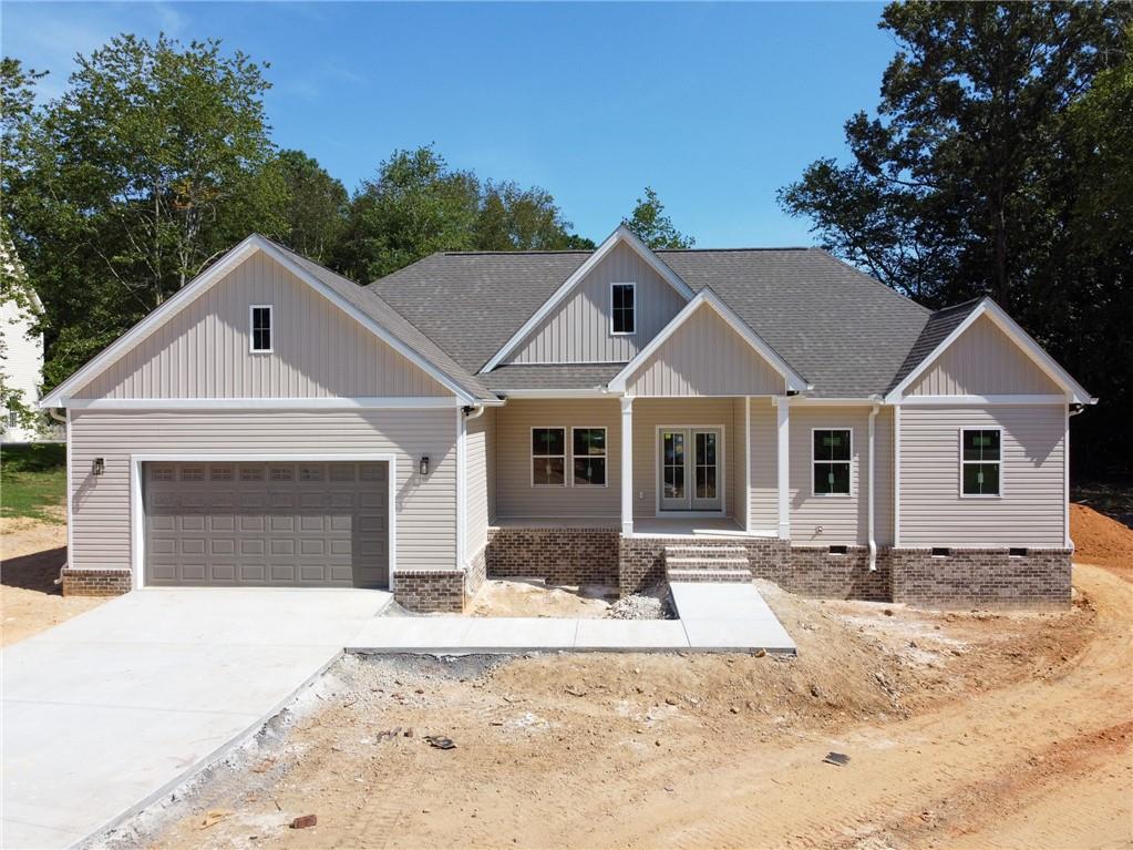 4-bedroom new construction located in a quiet cul-de-sac within an established neighborhood. Features include quartz and granite countertops throughout, luxury vinyl plank flooring, and a walk-in pantry. The master suite offers a separate tile shower and direct access to the laundry room through the walk-in closet. Enjoy a brick fireplace and a large covered patio. Estimated completion by the end of August.