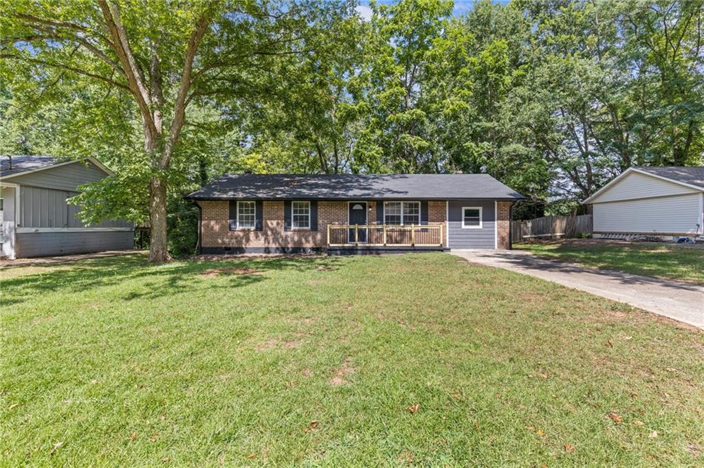 Fully remodeled with four bedrooms and two full bathrooms at the ranch on 8221 Queens. This four sided brick ranch is all brand new and sits on a level front and backyard! Walk to your front door with a new wood and wrought iron-esque railing. The spacious kitchen is fully remodeled and has stainless steel appliances. Behind the kitchen is your separate laundry room. Four bedrooms and two full bathrooms, of which are all luxury vinyl plank- NO CARPET in this home! A list of contractor updates include: NEW AC with cage, NEW water heater, all new interior paint, kitchen granite countertops and appliances, new gutters, all new light fixtures and fans, new flooring, new vanities in baths, and updated front porch and back patio. Make an appointment today and let's put your LAST name on this FRONT door!