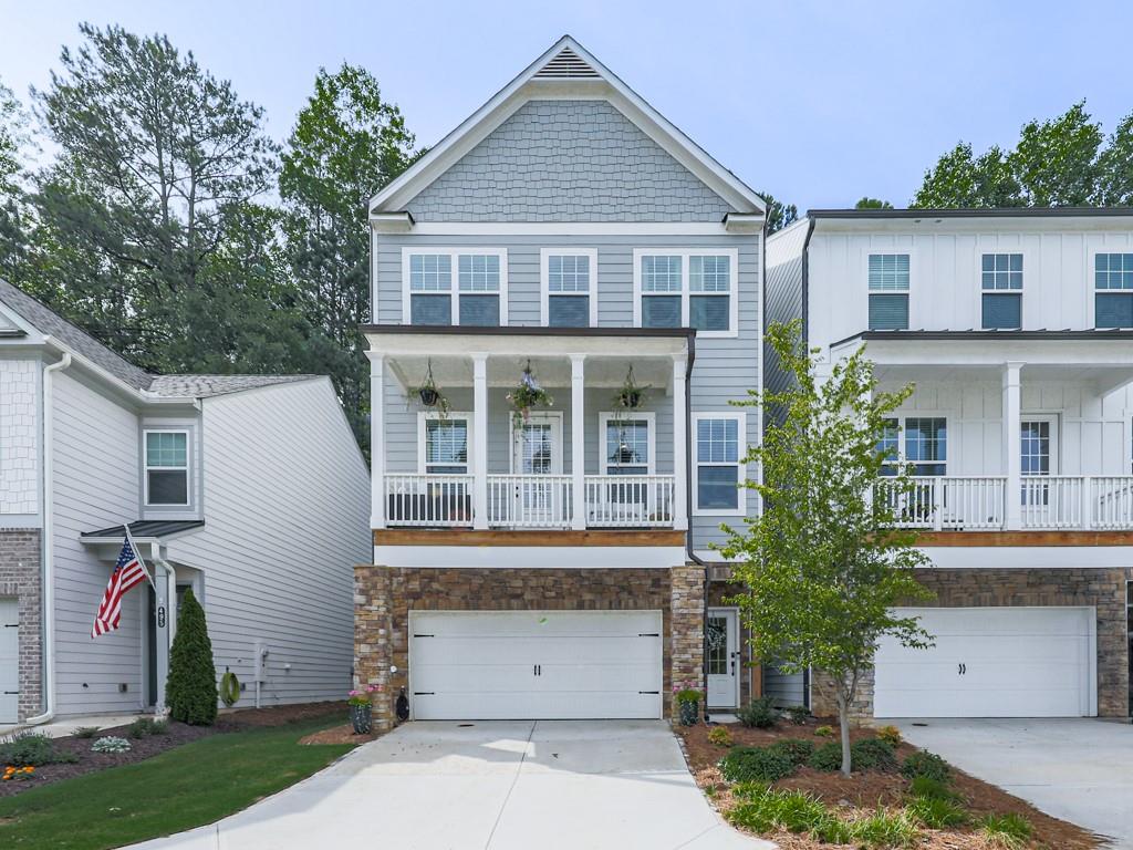 Downtown Woodstock GEM! Walkable, Stylish and Practically NEW! Welcome to this stunning 3-bedroom, 2.5-bathroom home located right in Downtown Woodstock. Built in 2023 and beautifully maintained, this home offers the perfect blend of modern design and unbeatable location. Open concept layout, light-filled living spaces designed for everyday comfort and entertaining. Flex room off the kitchen, perfect for a home office, playroom or cozy den. Interior features you will absolutely love is a custom pantry for stylish and organized storage. Custom primary closet with thoughtful design and space. Gorgeous finishes and custom light fixtures. Spacious bedrooms and modern bathrooms. Covered front deck you can drink your coffee or read a book! 10x20 COVERED back patio, ideal for relaxing, dining, and entertaining. Flat usable backyard that backs up to woods! Unfinished basement, stubbed for a future bathroom and ready to make your own. This charming home as a unique backyard surprise; a picturesque train track that runs along the backside of property. The train passes only on weekdays, mid-morning and early afternoon, offering a fun, occasional spectacle during the day! Walkable lifestyle, just steps from vibrant restaurants, shops, and entertainment. Golf cart friendly, just cruise around the neighborhood and downtown Woodstock with ease. Walk or just ride your golf cart to Downtown Woodstock's best spots. Quick access to parks, trails, top schools, and major roads. A rare opportunity to live in a nearly new home so close to all the action.