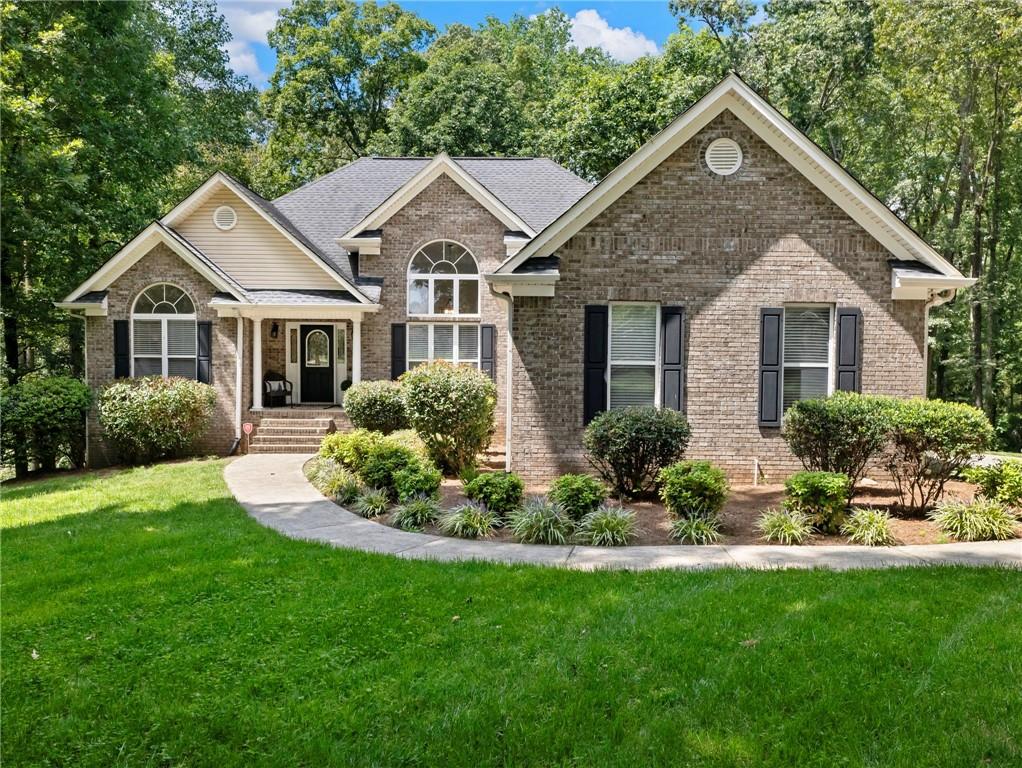 Rare Ranch on Full Basement in Prime Braselton Location
This hard-to-find ranch home sits on a private 1+ acre lot in a quiet enclave of just 15 homes—with no HOA. Conveniently located minutes from Chateau Elan, the Northeast Georgia Medical Campus, and quick access to I-85, this property offers both privacy and accessibility.
The main level features a split-bedroom layout, placing the spacious Owner’s Suite on one side and two secondary bedrooms with a full bath on the other. The fireside family room with hardwood floors opens into a vaulted dining room, where expansive windows flood the home with natural light. A cheerful breakfast nook just off the kitchen provides peaceful views of the wooded backyard.
Step outside to a large screened porch, perfect for year-round enjoyment of the outdoors. The full unfinished basement with high ceilings and a stubbed bath offers endless opportunities for expansion—whether additional bedrooms, recreation space, or an in-law suite.
This property combines the ease of single-level living with the rare flexibility of a basement home in a sought-after area.