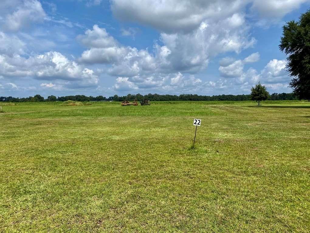 Beautiful residential lot located in the quiet Honeysuckle Farms subdivision. Lot 22 offers a peaceful setting just off Liberty Expressway, with scenic views overlooking open farmland. This homesite combines the charm of country living with quick access to nearby shopping, schools, and amenities. Ideal for those seeking a quiet neighborhood with beautiful natural surroundings. Bring your builder and vision to this lovely homesite.
