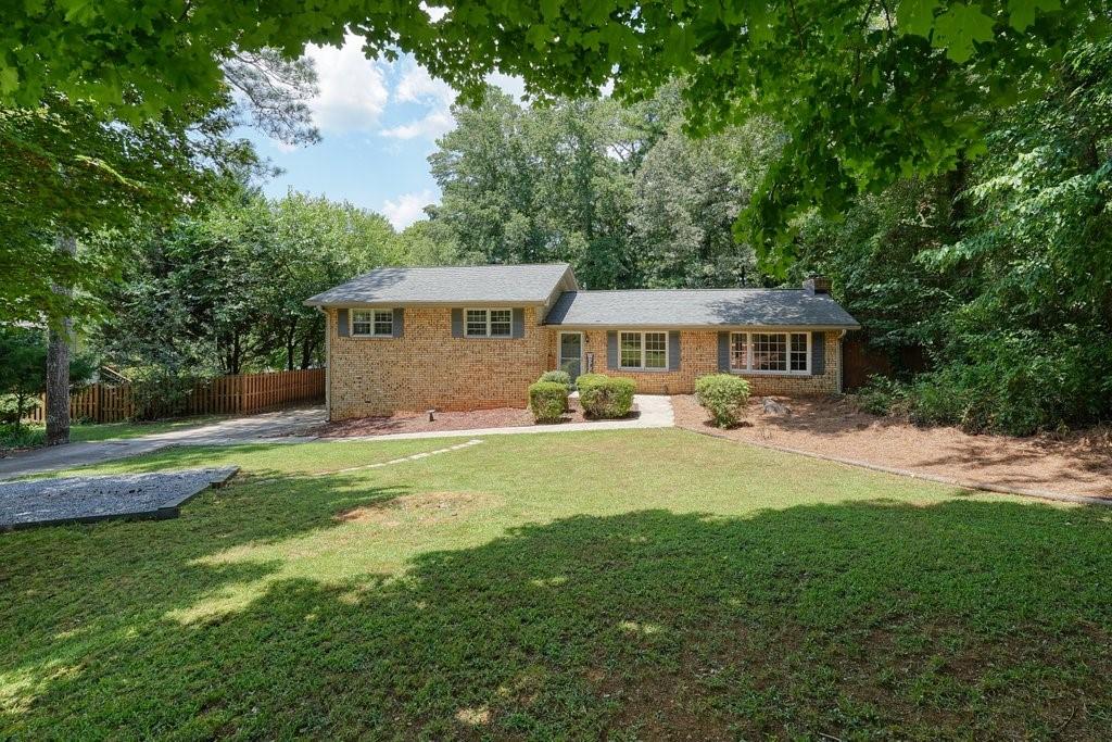 Discover classic charm and modern potential in this 4-sides brick ranch, perfectly situated on almost an acre just minutes from vibrant Downtown Woodstock. Built in 1973, this well-maintained 3-bedroom, 2-bath home offers beautiful hardwood floors, a bright and freshly painted interior, and a cozy brick fireplace for relaxing evenings at home.
The partial finished basement includes a third full bathroom that’s ready for your finishing touches — perfect for expanding your living space or adding a guest suite.
Step outside to your private, fenced backyard complete with a firepit — ideal for entertaining or unwinding under the stars. Recent updates provide peace of mind: new interior HVAC system, new water heater, fully encapsulated crawlspace, and a recently serviced septic tank.
Enjoy incredible access to the upcoming Noonday Creek Trail extension, which will connect Downtown Woodstock to Noonday Creek Park and beyond — ride your bike all the way to the Silver Comet Trail and into Alabama without ever leaving a paved path!
With its unbeatable location less than 5 minutes to Downtown Woodstock’s shops, dining, and entertainment, this home is move-in ready and waiting for your personal touch.
Don’t miss this rare opportunity!