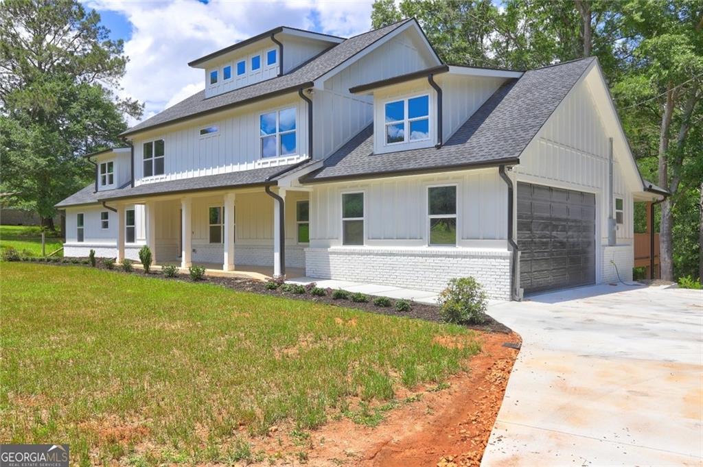 Completely renovated and move-in ready, this stunning 4-bedroom, 3.5-bath home offers a perfect blend of modern luxury and functional space on a private 2.37-acre lot. Inside, you'll find soaring ceilings in the dramatic two-story living room, a spacious bonus room ideal for a home office or playroom, and a thoughtfully designed open-concept layout. The gourmet kitchen features sleek countertops, stainless steel appliances, and abundant cabinet space-perfect for everyday living and entertaining alike. The primary suite offers a spa-like bathroom retreat, while all secondary bedrooms are generously sized. Recent upgrades include a new roof, HVAC system, windows, doors, and flooring throughout. Step outside to a covered rear deck overlooking the expansive backyard, ideal for relaxing or hosting guests. Conveniently located just minutes from shopping, dining, and major commuter routes-this home truly has it all.