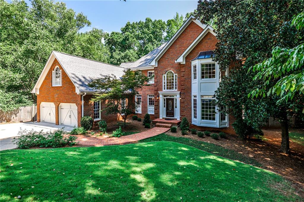 This elegantly updated residence offers refined living in Roswell’s premier Horseshoe Bend community. The main-level primary suite boasts a completely renovated spa bath with a jetted tub, frameless glass shower, marble double vanities, designer lighting, and elegant tile floors. Freshly painted interiors and gleaming hardwoods throughout the main level—including the primary suite and walk-in closet—extend to the upstairs hallway and landings. Secondary baths feature stylish updates, while the granite and stainless steel kitchen with custom cabinetry, dual pantries, and a new designer faucet flows seamlessly to a sunroom overlooking the heated pool and spa. The rear stairs by the kitchen are convenient.
The finished daylight basement offers a full bath, entertaining bar, game/exercise areas, and Saltillo tile floors ideal for post-swim gatherings. Exterior enhancements include new garage doors with belt-driven openers, a cedar deck re-stained in 2025, new front and rear flood lighting, and a professionally landscaped front yard with irrigation, fresh plantings, and lush Zoysia sod.
The heated Gunite pool and spa shine with a new water pump, sand filter, skimmer baskets, renovated travertine spillway, resealed border tiles, paver decking, and automated controls with freeze protection. Professionally maintained for year-round enjoyment.
Optional Horseshoe Bend Country Club membership offers championship golf, tennis, pickleball, resort-style pools, dining, and vibrant neighborhood events. Just four miles to GA-400 and minutes from Historic Roswell and the Chattahoochee River. A perfect blend of luxury, leisure, and location.