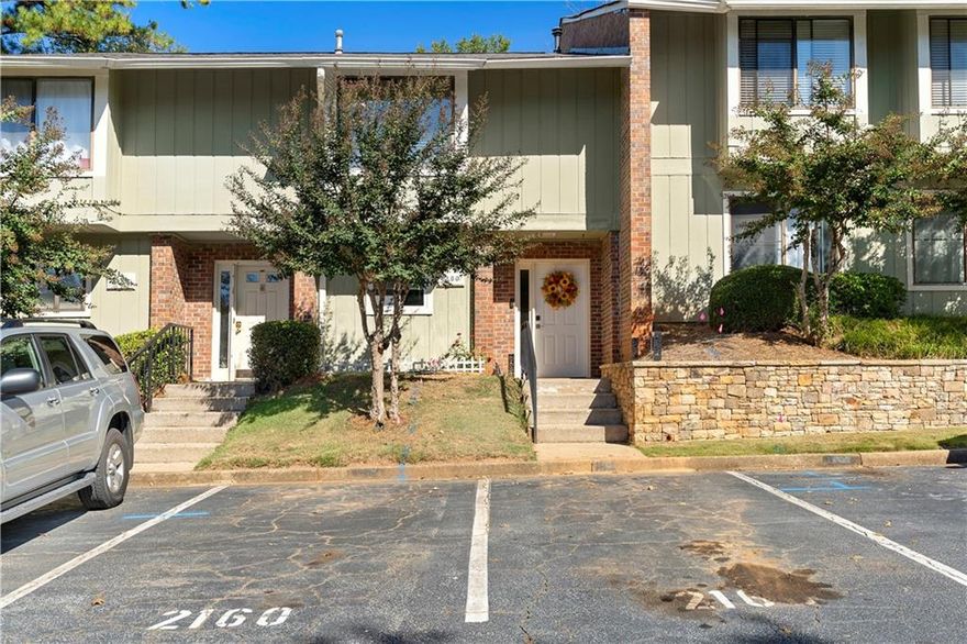 Welcome home to this beautiful 2 bedroom, 2.5 bath condo that perfectly blends modern style with everyday comfort. The open concept main level features a spacious living area with a wet bar connecting the dining space and living room along with sliding glass doors that open to your own private fenced yard, perfect for relaxing or entertaining. The kitchen is a true highlight, showcasing granite countertops, two tone cabinetry, stainless steel appliances, and a subway tile backsplash. Upstairs, both bedrooms are generously sized with plush carpeting, large closets, and updated baths with contemporary finishes. The primary suite includes a private balcony for enjoying morning coffee or evening breezes. Smart home features add modern convenience and efficiency throughout. Ideally located near many shopping and dining options, this move in ready condo offers the perfect combination of comfort, style, and convenience.