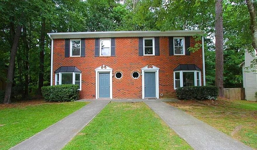 Beautifully maintained brick-front duplex tucked on a quiet cul-de-sac — offering both sides for lease just minutes from Marietta Square! This spacious 2-bedroom, 2.5-bath home features bright bay windows, updated countertops, and a cozy fireplace in the living area. Upstairs, each bedroom features its own private full bath and ample closet space, providing comfort and privacy for all. A convenient half bath is located on the main level for guests. Enjoy private driveway parking, low-maintenance landscaping, and a prime location near shopping, dining, and I-75 access. Situated in desirable Cobb County, this home provides comfort, privacy, and convenience — available immediately!