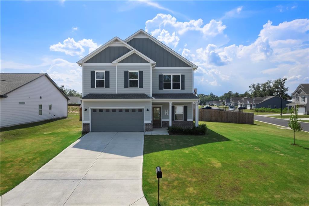 Welcome to The Harrington, the largest floor plan in Emerald Oaks Estates, perfectly positioned on the community’s largest lot at the corner of Royal Oak and Rambling Oaks! This spacious home offers an incredible blend of comfort, space, and style, all within the highly sought-after Armuchee School District. Conveniently located just minutes from Berry College, the Rome Braves stadium, and local dining and recreation, this home checks every box! Step inside to discover an airy, open layout featuring 9-foot ceilings on both levels and abundant natural light from the thoughtfully added extra windows. The heart of the home is the open concept kitchen, complete with a center island, stainless steel appliances, white cabinetry, a vented microwave, and a cozy breakfast nook. The living room flows seamlessly to an extended, partially covered patio—perfect for relaxing or entertaining. Upstairs, the oversized owner’s suite is a true retreat, featuring dual walk-in closets, a soaking tub, separate shower, private toilet room, and ample space to unwind. Three additional bedrooms, a full bath, and a convenient laundry room round out the second floor. With the largest floor plan on the largest homesite in the neighborhood, this exceptional home offers unmatched value, comfort, and convenience. Don’t miss your chance to own this stunning home in Emerald Oaks Estates—schedule your private tour today!