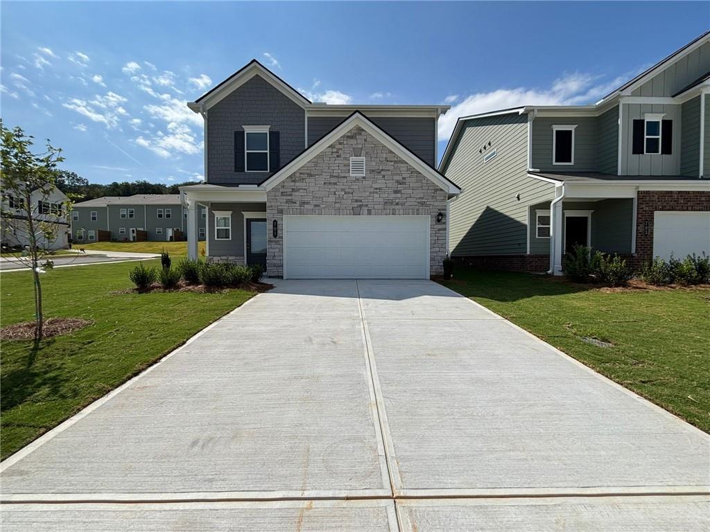 BRAND NEW! READY TO MOVE IN! END UNIT! AVAILABLE FOR RENT !3 Bedrooms with LOFT and 2.5 Bathrooms Single Family Home by Smith Douglas Homes, located in Highland Crossing in Cartersville. Within a few minutes to I-75 and major stores. This home greet you with a covered front porch with great curb appeal. Just off the Owner's entrance is a spacious kitchen with an island with a large pantry for easy grocery drop-off. The open and light-filled family room and dining areas have direct access to the backyard and covered patio for seamless entertaining. A generous upstairs owner's suite offers privacy and relaxation, while the laundry is just steps away. Three additional bedrooms, a shared bath and a space for a small office or reading nook complete this level. 9ft ceiling heights on both levels. Brand new Washer, Dryer and Refrigerator included.