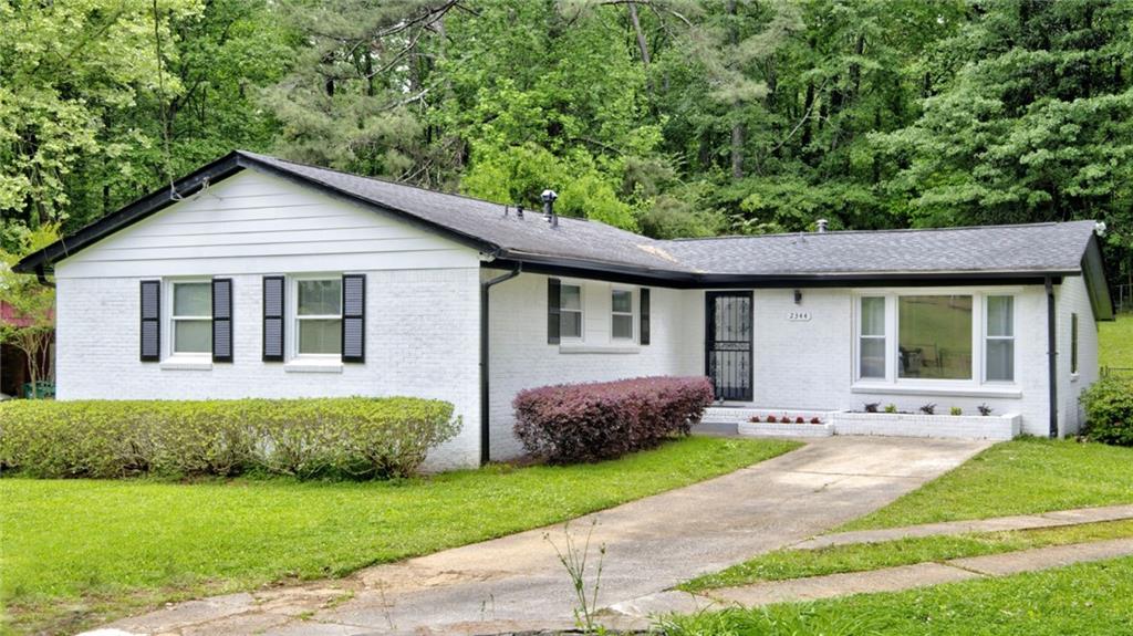 This beautifully remodeled 3/2 home is designed for entertaining! Very bright and open with lightly stained hardwoods and neutral walls. The kitchen is loaded with extras! All NEW stainless steel appliances (refrigerator is smudge resistant, too) Slide in gas range. A floor to ceiling pantry with the lower half having pull out drawers, a double garbage bin cabinet under the sink, rows of space saving pot drawers and 42" overhead cabinets, 2 of which have glass for added sparkle. All cabinets and drawers are soft closing. Large upgrade granite composite divided sink makes cleanup easy. Stove hood vents outside and not to the attic. Counter tops are quartz with the backsplash going to the ceiling on both side walls. The house flows extremely well as the large public spaces - the dining room and living room - have walk-in access to the kitchen and each other. Owner's shower is a must see! A closet behind the original shower was incorporated to make a very large shower with European style hardware and full glass enclosure. Spacious laundry and storage room. Very quiet neighborhood with little traffic. There are a Publix and a super-Walmart within 10 minutes. Back yard is completely fenced in for your pet's safety AND has an approx 9x6 ft walk in storage shed for tools. HVAC system is NEW. Roof recently replaced. Brand NEW 40 gallon gas hot water heater. Driveway is recently repoured and can park 4-5 vehicles.