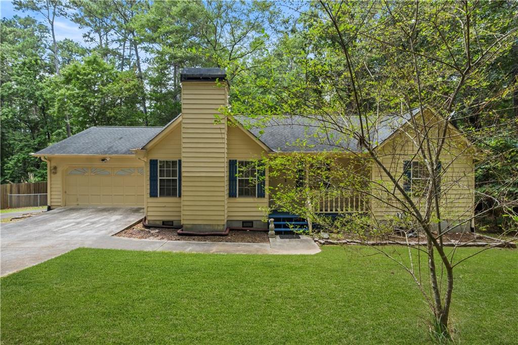 CHARMING 3-BED/2-BATH UPDATED RANCH ON ONE ACRE IN LOGANVILLE - NO HOA! This home seamlessly blends blends comfort and character, featuring a beautifully styled kitchen with warm navy blue cabinets and gold accents. The open-concept dining and kitchen area flows seamlessly into a cozy living room with a fireplace, perfect for relaxing or entertaining.
Enjoy the outdoors with a fenced backyard, mature trees, and a spacious back deck with stairs leading to the yard. A welcoming front porch offers the perfect spot for rocking chairs and quiet mornings.
Thoughtfully designed and nestled in a peaceful setting, this home is filled with charm and ready to welcome you home.