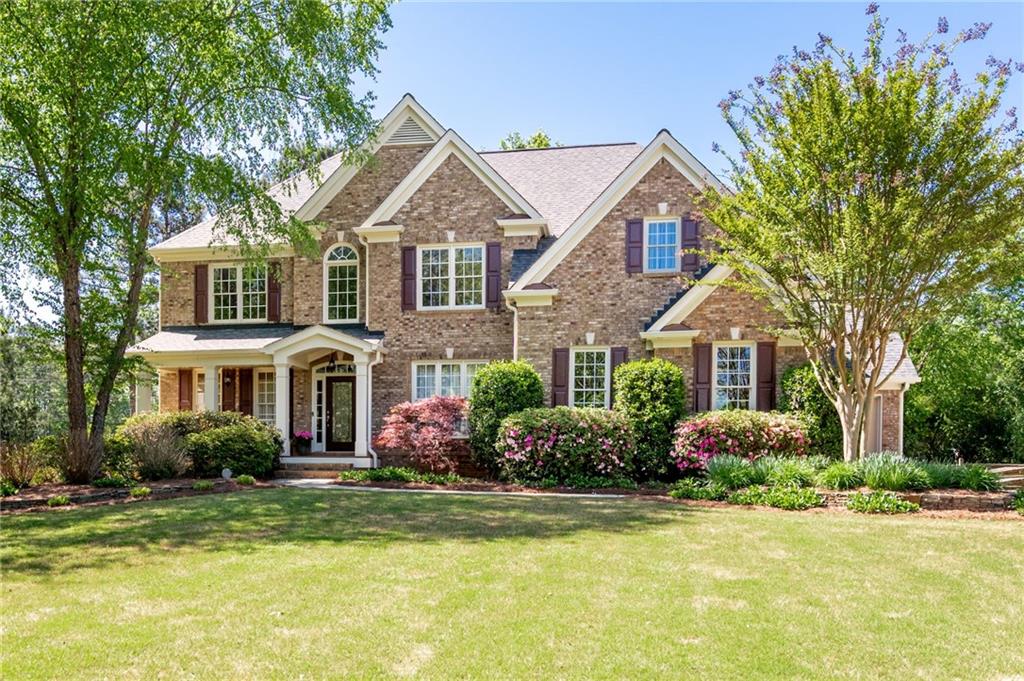 If you are looking for a well-maintained home, you have found it! Pride of ownership is a common theme throughout this Hickory Springs 3-sided brick beauty. The owners have gone through many weeks of prepping to get their beautiful home ready to market, and it shows! New exterior paint, done! Decking stained, done. New neutral interior paint, done. New carpet on all levels of the home, done. All new stainless steel kitchen appliances, done. Windows washed, done. Fresh new pine straw, done. Located on the heart of West Cobb in one of Cobb's most coveted school districts- Ford, Lost Mountian, Harrison High School, this home is ready for its next owner-- that might just be YOU! Step up to the front door and take note of the covered porch where your Amazon deliveries will stay nice and dry. The front porch is a perfect place for a set of rockers to enjoy summer evenings and watch the family ride bikes in the cul-de-sac. Walk into the foyer and notice the oversized dining room on the right and living room on the left which would also make a great office space. The wall of windows in the great room give lots of light and warmth (has a protective film applied) and is the focal point of this open floor plan. The view from these windows is a lovely green pasture with horses--one of the many features that makes this home unique. The kitchen boasts ALL NEW stainless steel appliances, dark cabinets, walk-in pantry, and island and eat-in kitchen. There is bedroom on the main and full bath for guests. Upstairs you'll find four more bedrooms and a very spacious bonus room that is perfect for a teen suite, office, even another bedroom if you add a closet! The owner's suite is oversized and has very large walk-in closet. The owner's bath has dual vanities, tiles walk-in shower, and a spa-like tub. One guest bedroom has its own bathroom and the other two guest rooms share a jack-n-jill bath. The finished terrace level has so much space! It would make a great in-law suite! It's equipped with a mini kitchen and eat-in area, family room, full bath, media/theatre room, workout room(That can also be a bedroom if you add a closet) and a smaller room that's great for storage or a craft room. The backyard is fenced and flat! It's a wonderful yard for fur-babies to run and play while you take in the beauty of the landscaped yard. If you want a pool this yard is PERFECT for that! The neighborhood amenities offer pool, tennis, 2 playgrounds, a neighborhood pond and a clubhouse for scheduled events. Hickory Springs is a great place to live! Schedule and appointment to view your new home.